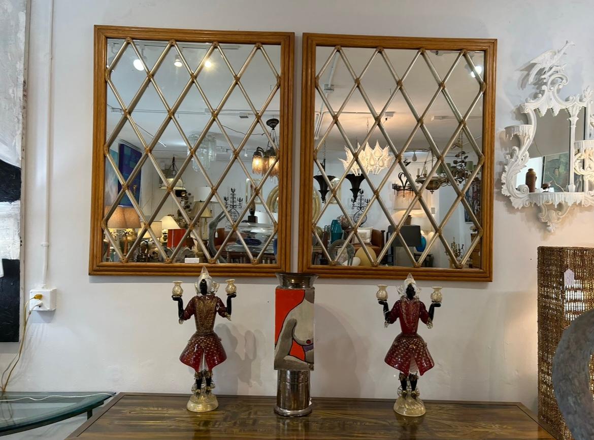 A fine pair of mirrors by McGuire of San Francisco… The height is 50 inches width 40 inches and the depth 2 1/2 inches… the frame is three part stacked wood… The lattice is also wood in a silver leaf finish… The lattice is Leather wrapped… In very