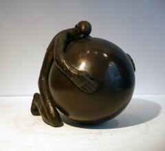 Peace, figurative bronze by Maguy Banq, man embracing earth with tenderness