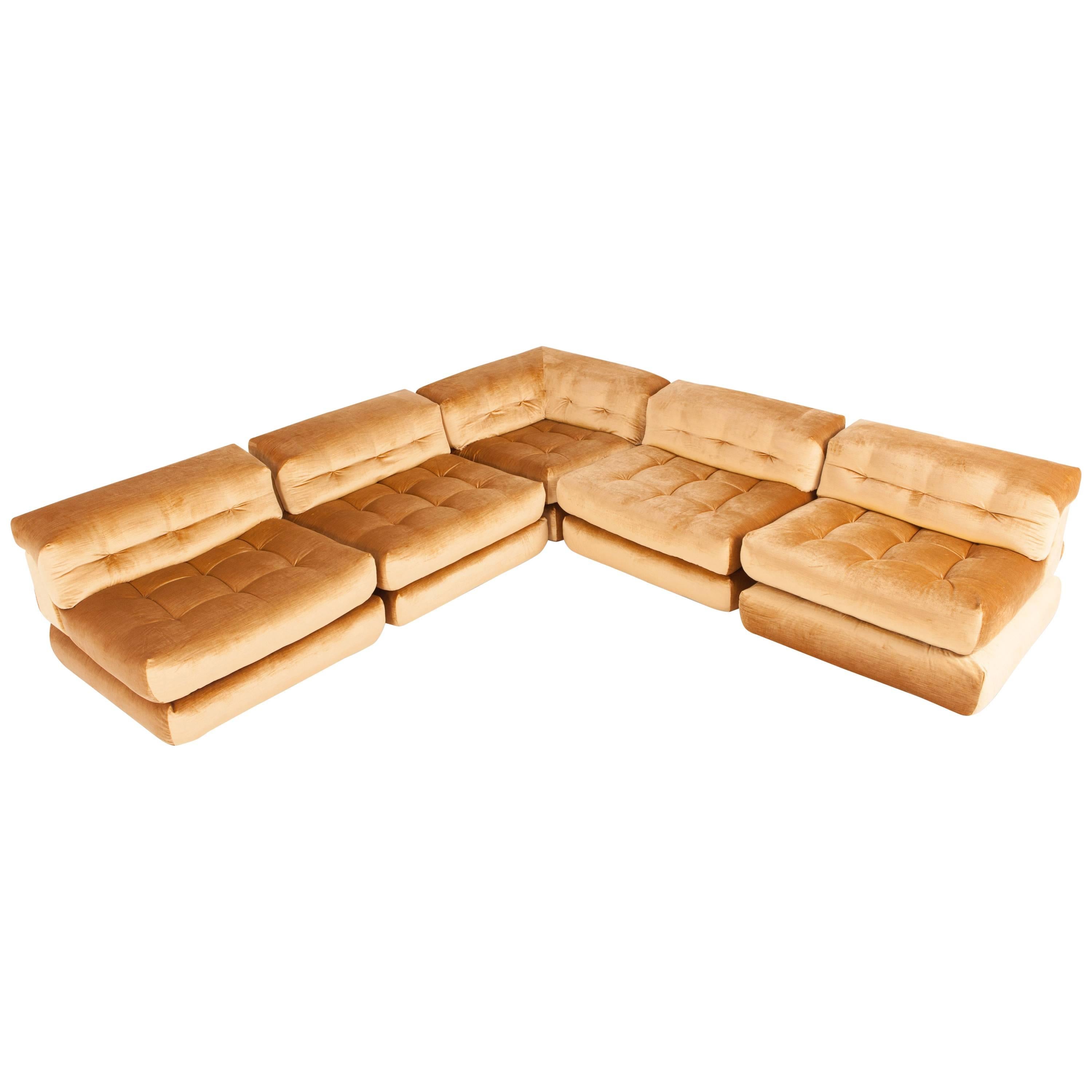 Hans Hopfer first edition Mah Jong modular sofa from the 1970s
by Hans Hopfer and Philippe Roche
reupholstered in golden velvet

In the 1970s Hans Hopfer created the Mah Jong lounge sofa, Roche Bobois’s most recognized and iconic design. The