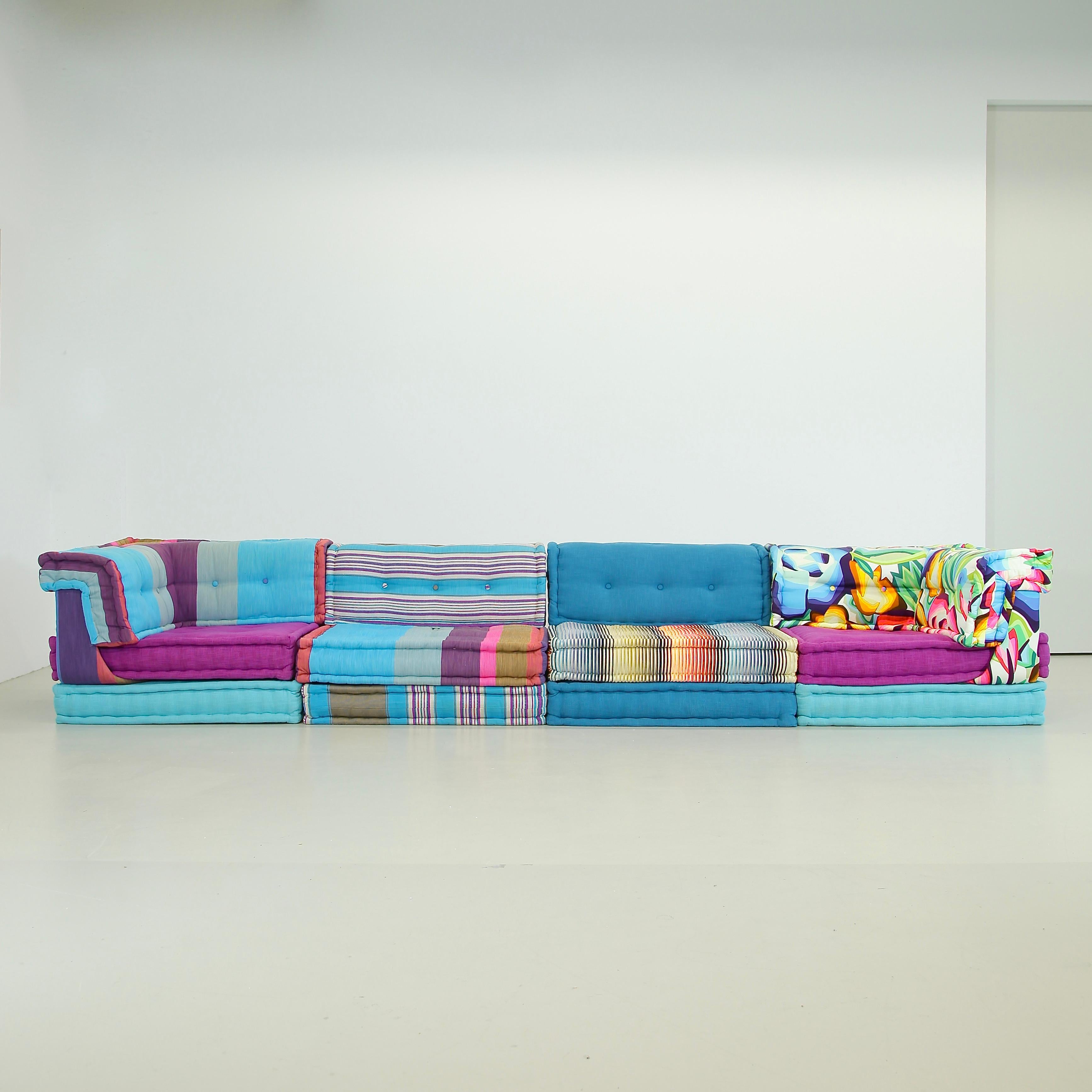 Modular sofa group, designed by Hans Hopfer. Roche Bobois, France, 1971.

Beautiful large modular sofa with a mixture of components, hand-sewn rolled edge, quilted seat and back cushions, upholstery designs by Missoni and others. The set comprises