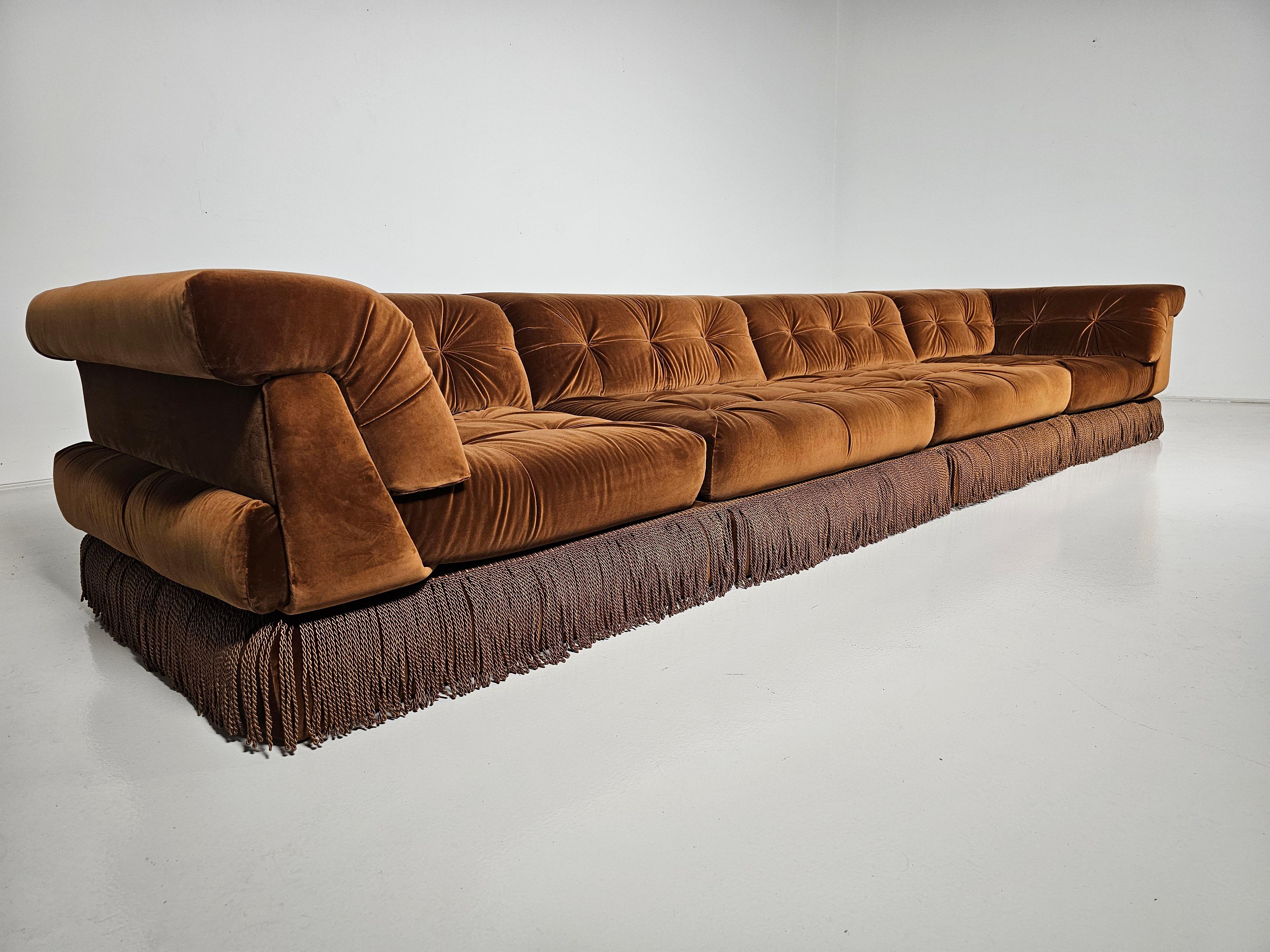 1st edition  Mah Jong modular sofa set by Hans Hopfer, designed in 1971 for Roche Bobois. It features multiple cushions that can be arranged in an endless number of ways, This set includes 8 cushions and 4 backrests.  Reupholstered in caramel brown