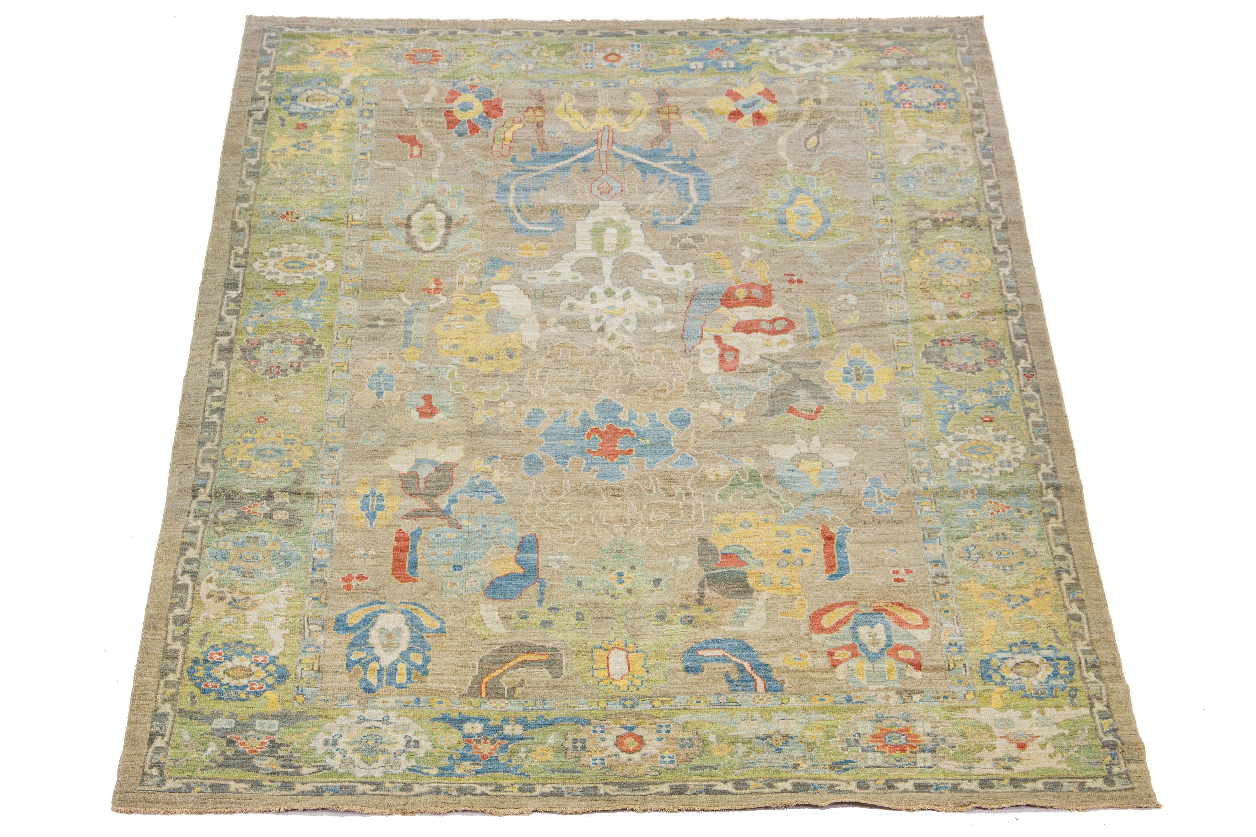 Beautiful modern Sultanabad hand-knotted wool rug with a light brown field. This Sultanabad rug has a green frame and multicolor accents in a gorgeous all-over classic floral pattern design.

This rug measures 8'10