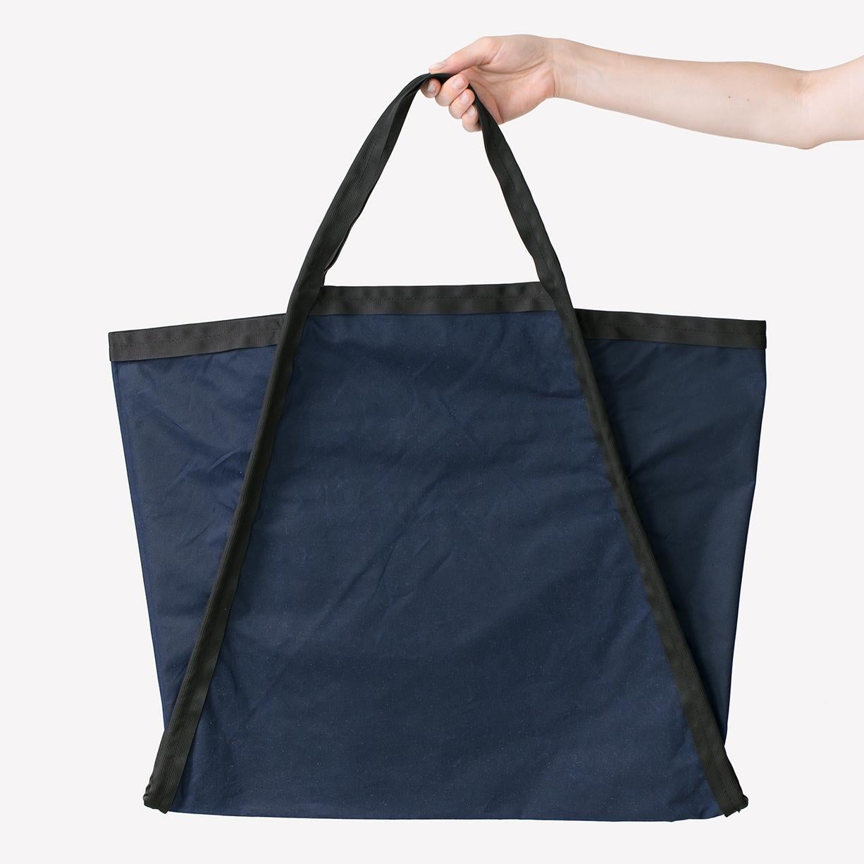 Maharam Bag
Three Large by Konstantin Grcic 
003 Indigo/Black

Konstantin Grcic (b. 1965, Germany) is a Munich-based industrial designer who combines deep research with an investigation into emerging technologies. He trained as a cabinetmaker before