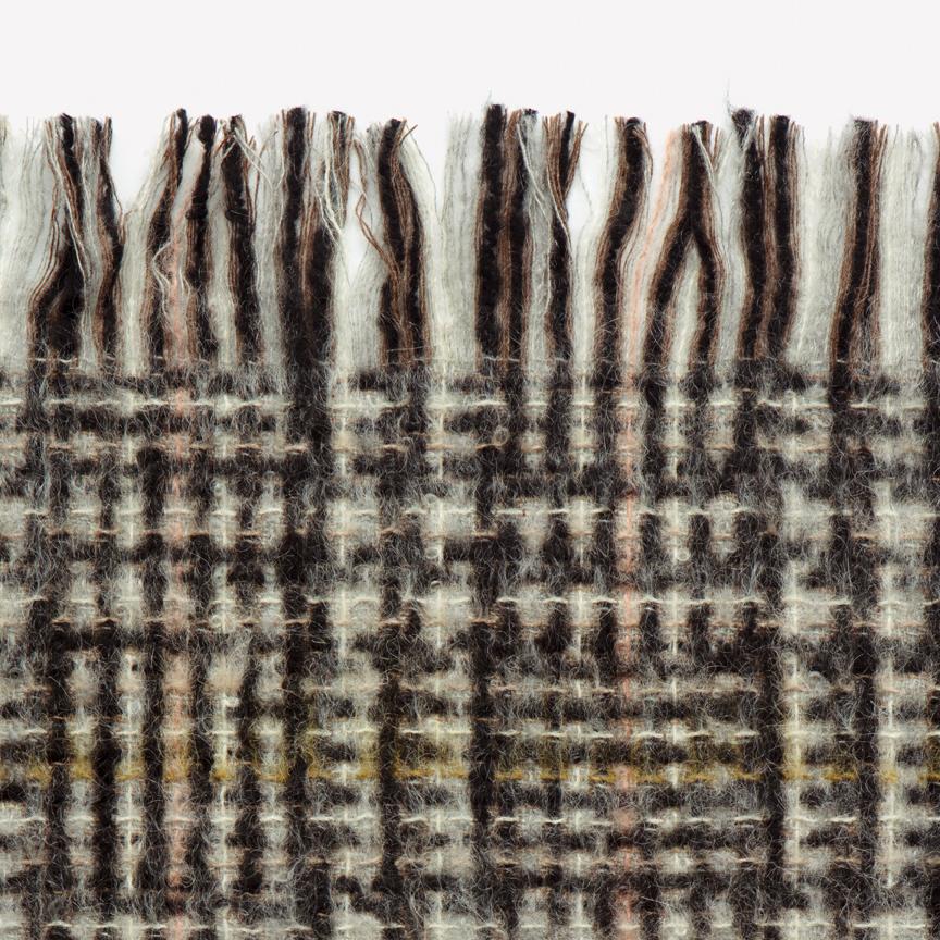 Maharam Throw
Passel 
001 Coati

Adapted from Maharam's eponymous upholstery textile, Passel Throw is woven in France on the same looms used to produce many Chanel suiting materials. A light brushing process lends a lofty body and soft hand to