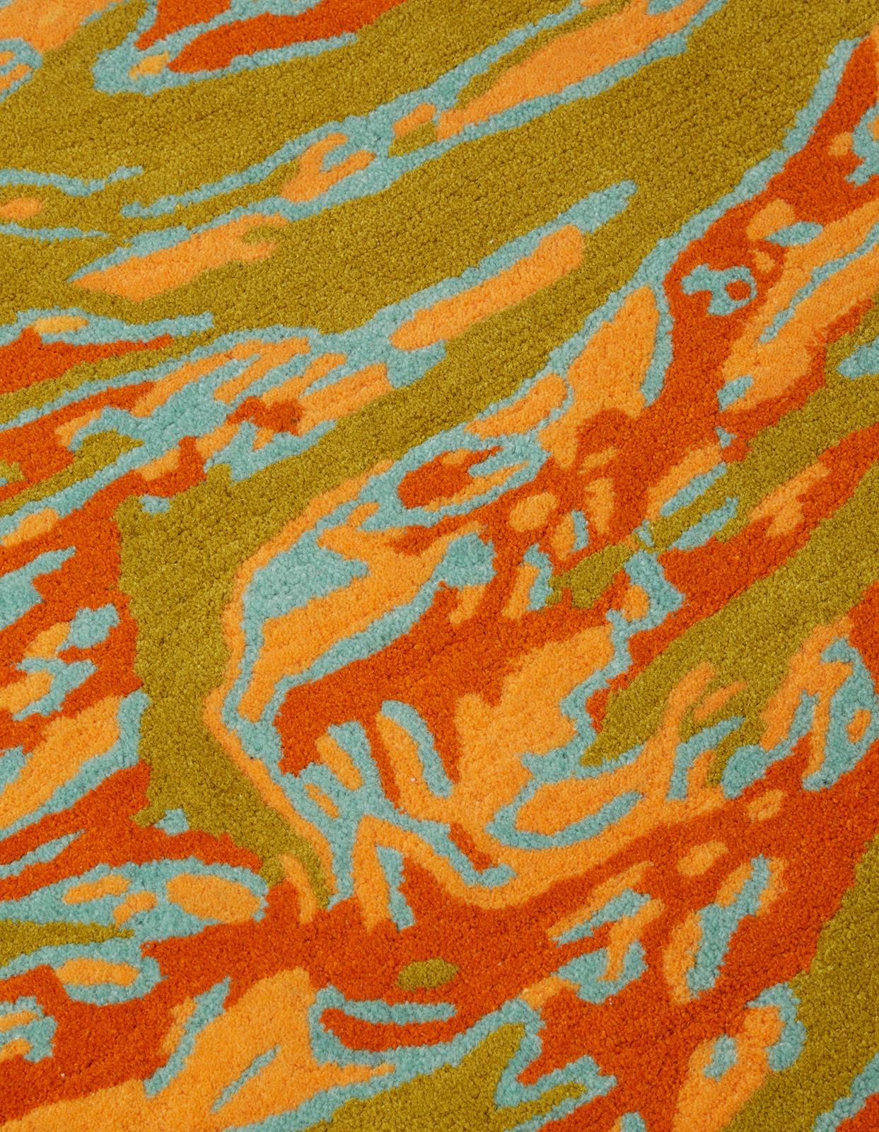 Maharishi and The Andy Warhol Foundation continue their ongoing series of collaborative works with this wool rug. 

Based on Andy's 1986 camouflage works, his vivid pop colors have been reworked in DPM: Tigerskins. Each rug is hand tufted and