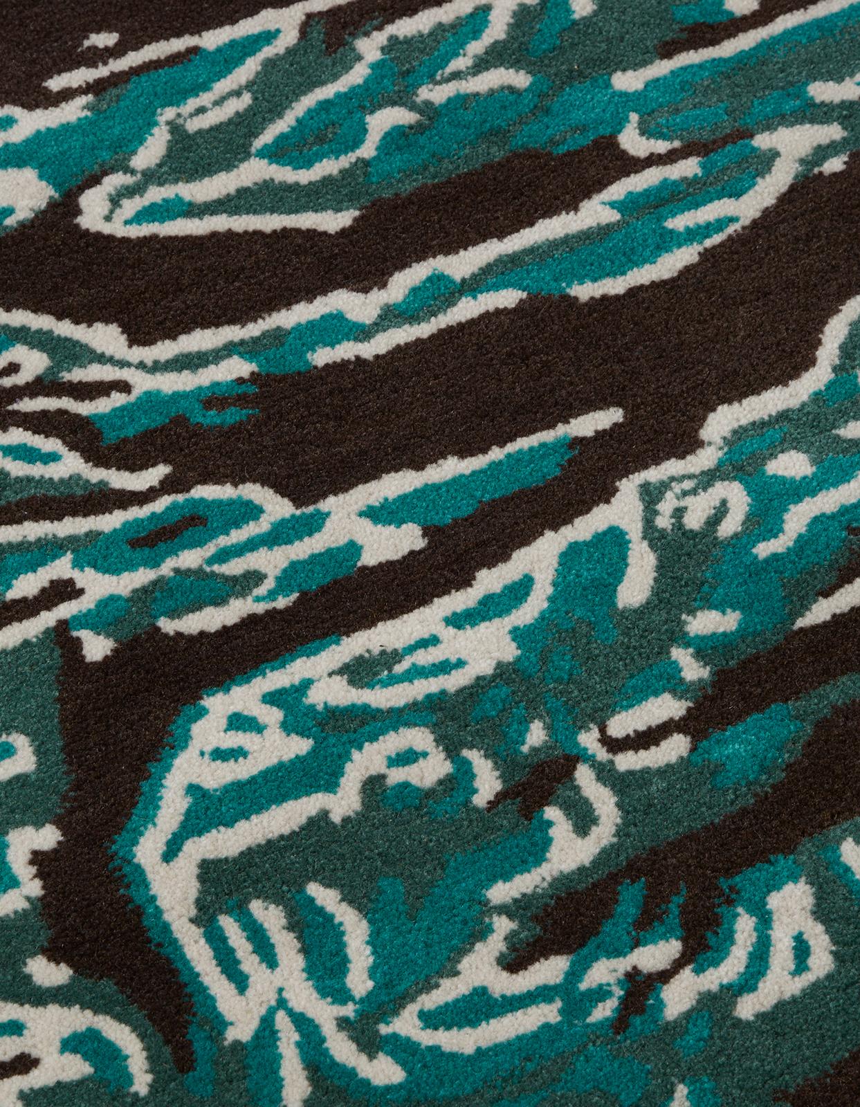 DPM: Pop Tigerskins Series 3 

Maharishi and Andy Warhol continue their ongoing series of collaborative works with this wool rug. 

Based on Andy's 1986 camouflage works, his vivid pop colours have been reworked in DPM: Tigerskins. Each rug is