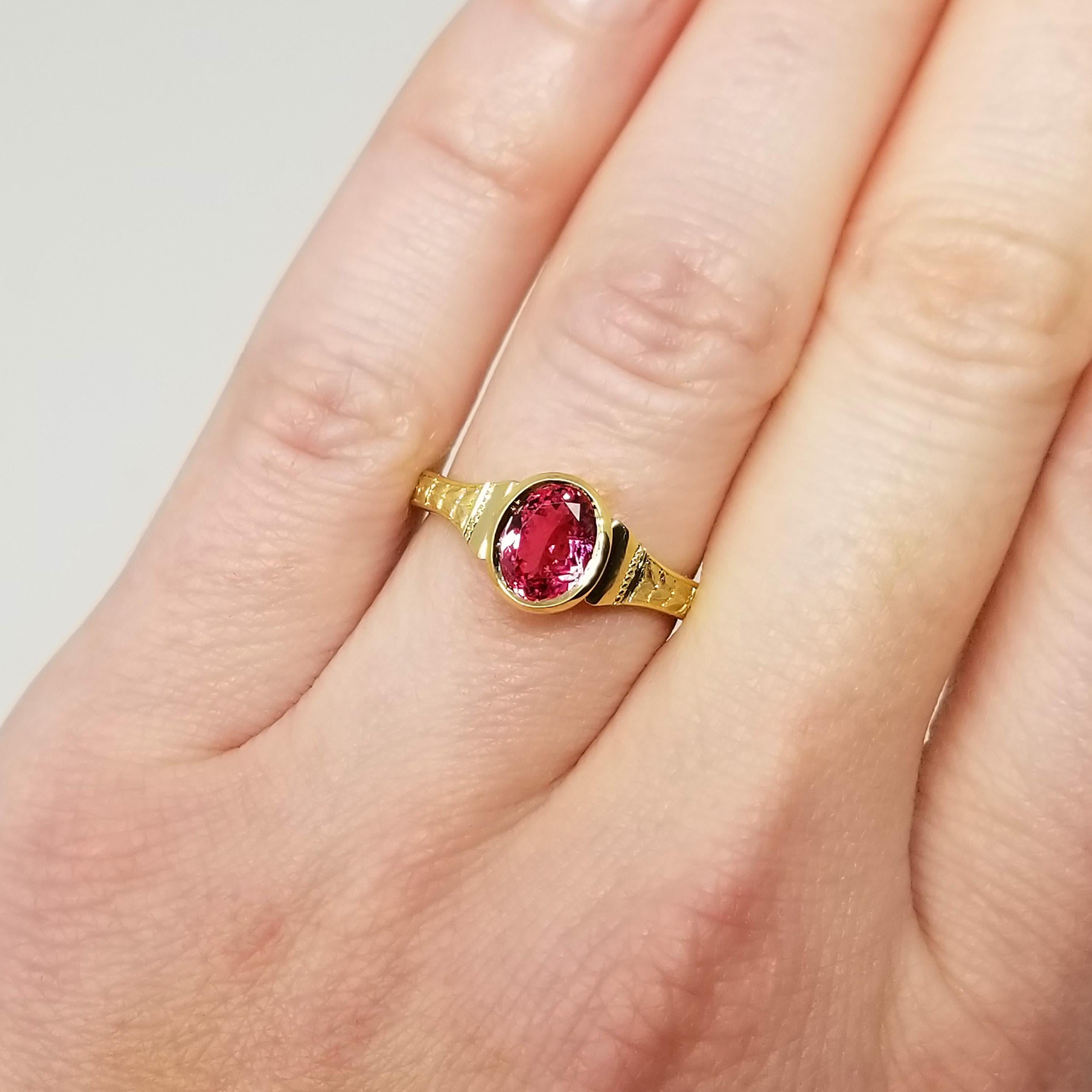The Cassandra Ring is the perfect showcase for spectacular gemstones on the smaller side: it frames beautifully, keeps the focus on an important gem, and highlights without distracting. This particular 18kt Cassandra ring features a fiery hot pink