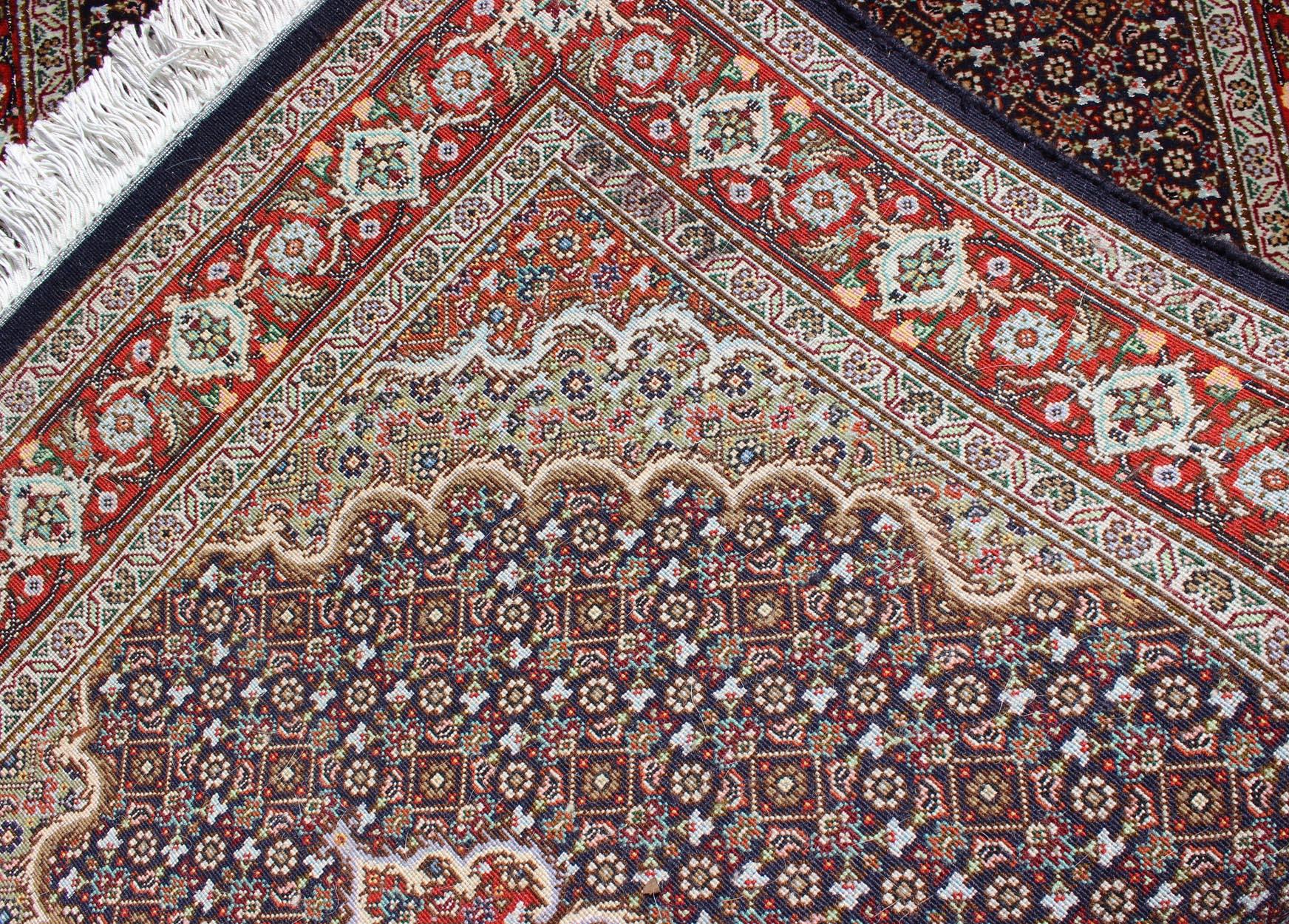 Vintage Persian Tabriz runner-
This semi antique Tabriz runner is handwoven of wool and silk features a repeating medallion design rendered in red and brown tones.
Measures: 2'7 x 12'.