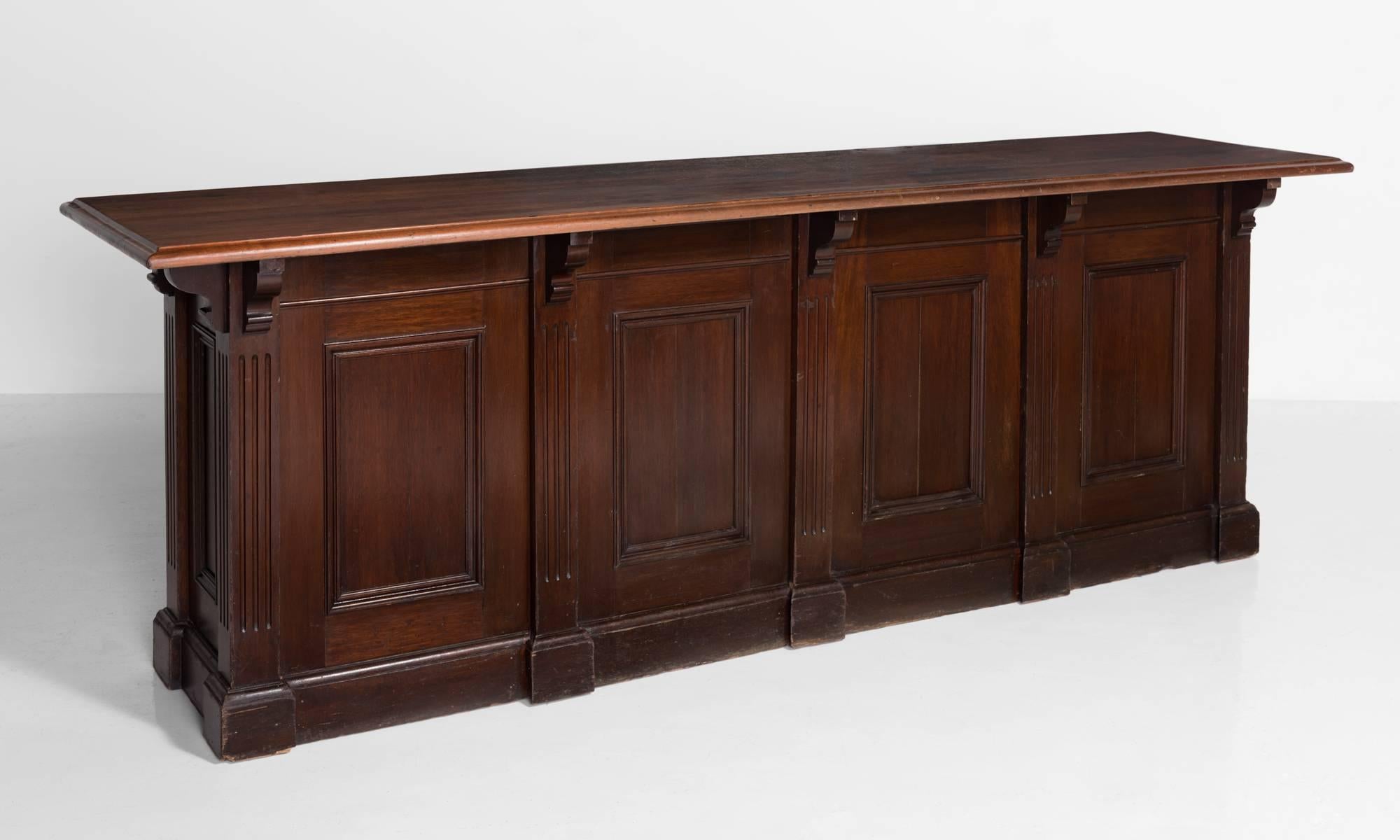 Mahogany & Oak Shop Counter, England, circa 1920

Amazing freestanding counter with mahogany show wood on the front and sides, with oak drawers and cupboard on the back.