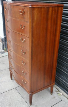 Mahogany 1950s English serpentine front 'tall boy' chest of drawers