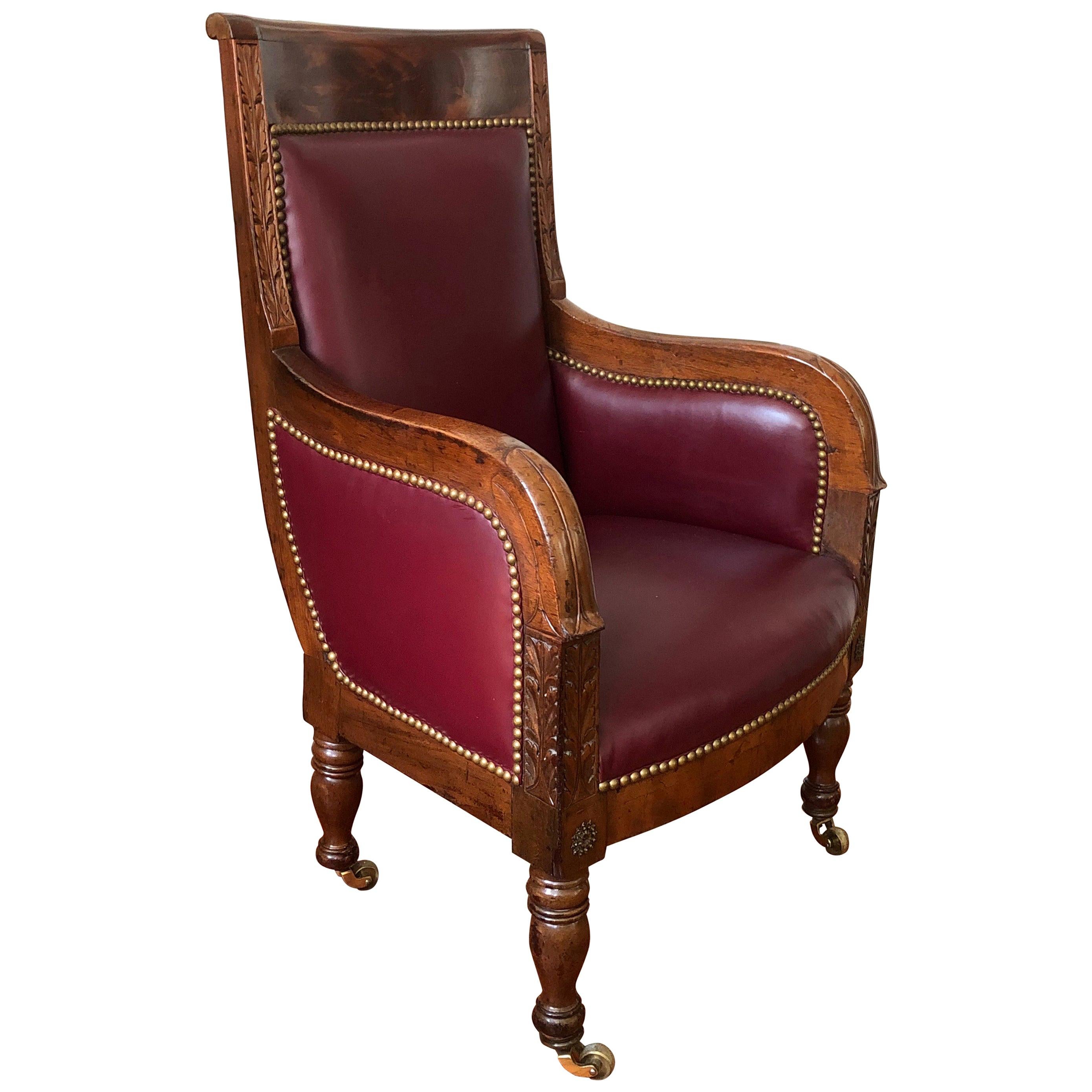 Mahogany 19th Century Empire Library Chair on Brass Casters For Sale