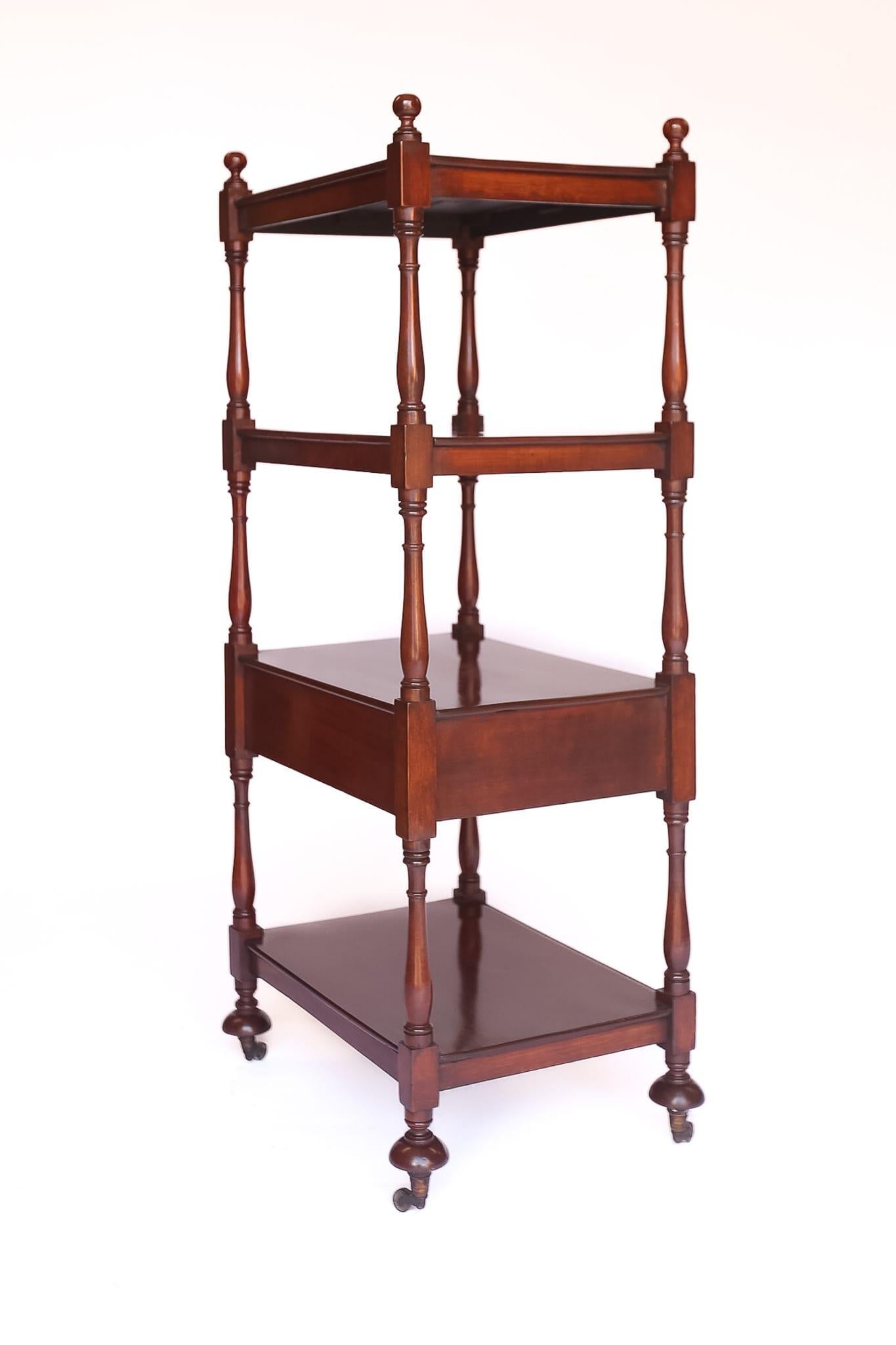 Mahogany 4 tier Whatnot with single drawer, circa 1830
4 turned finials on top, 
4 tier mahogany shelves, 
Figured mahogany drawer front, turned knob handles,
mahogany drawer linings, fine hand cut dove tails, 
sitting on 4 turned feet, with brass