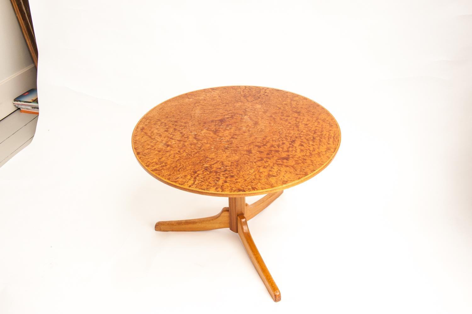 A unique and beautiful round table, model no. 560. Table, octagonal pedestal and three feet, made of solid mahogany. Round top with ambiona burl veneer.

Designed in 1932 by Josef Frank for Svenskt Tenn. Manufactured by Karl Holmberg AB in the mid