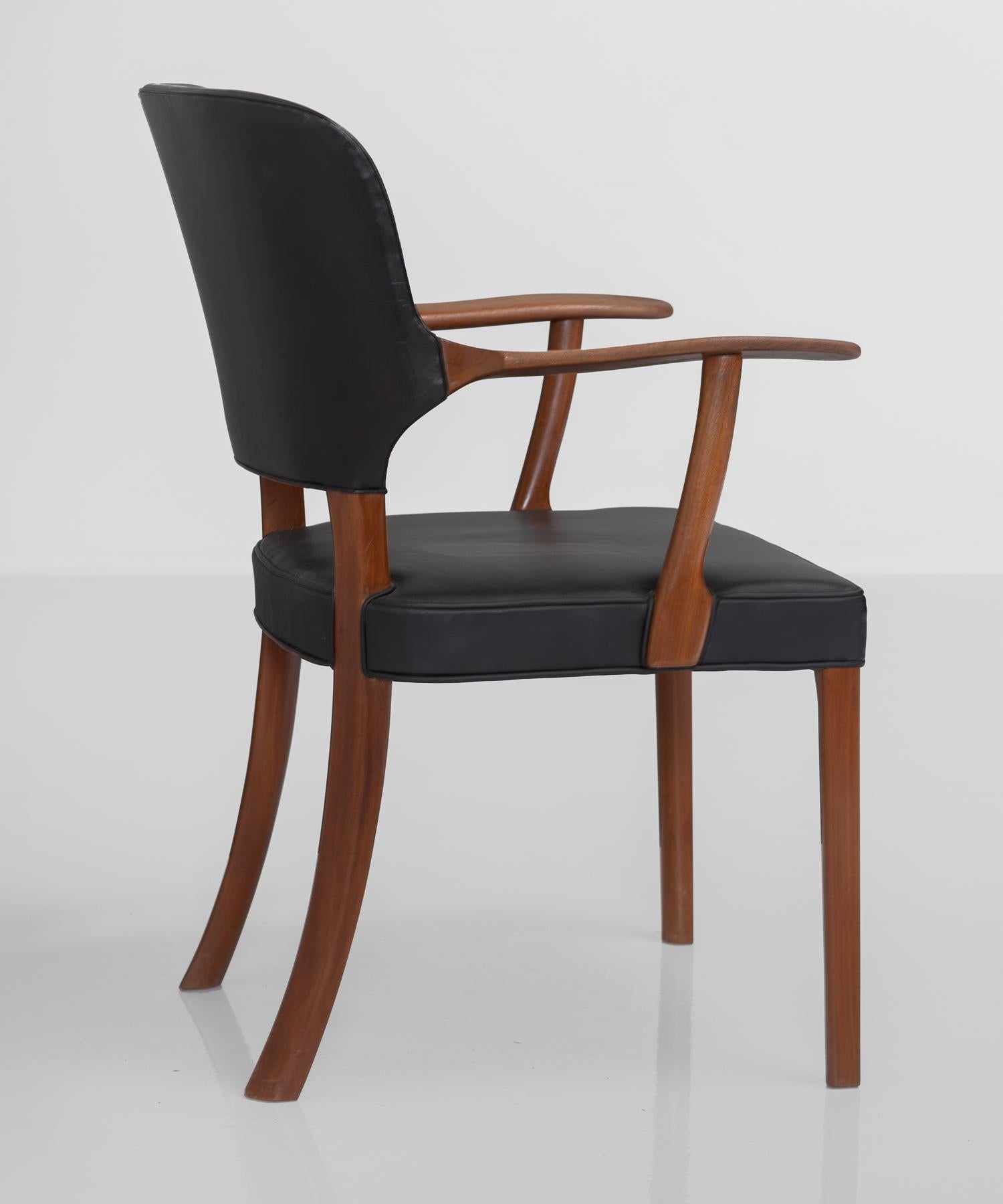 Mahogany and black leather armchair by Ole Wanscher, Denmark, circa 1940.

Beautifully designed chair constructed in mahogany with leather upholstery. Designed by Ole Wanscher for Danish cabinetmaker A.J. Iversen.