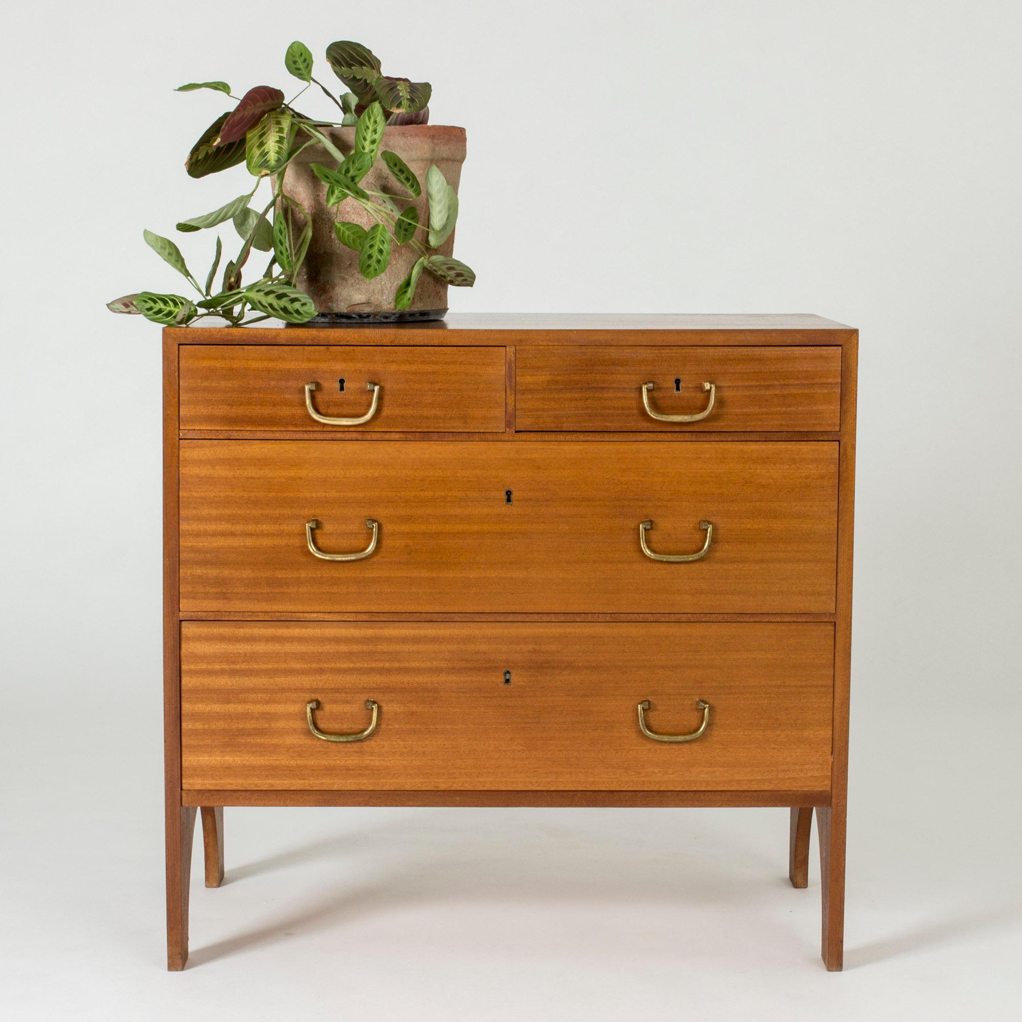 Cool mahogany chest of drawers by Josef Frank, with an amazing, playful silhouette. Elegant brass handles.