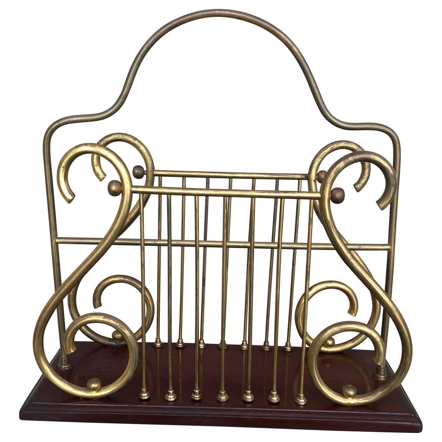 Mahogany and brass harp shaped magazine rack.