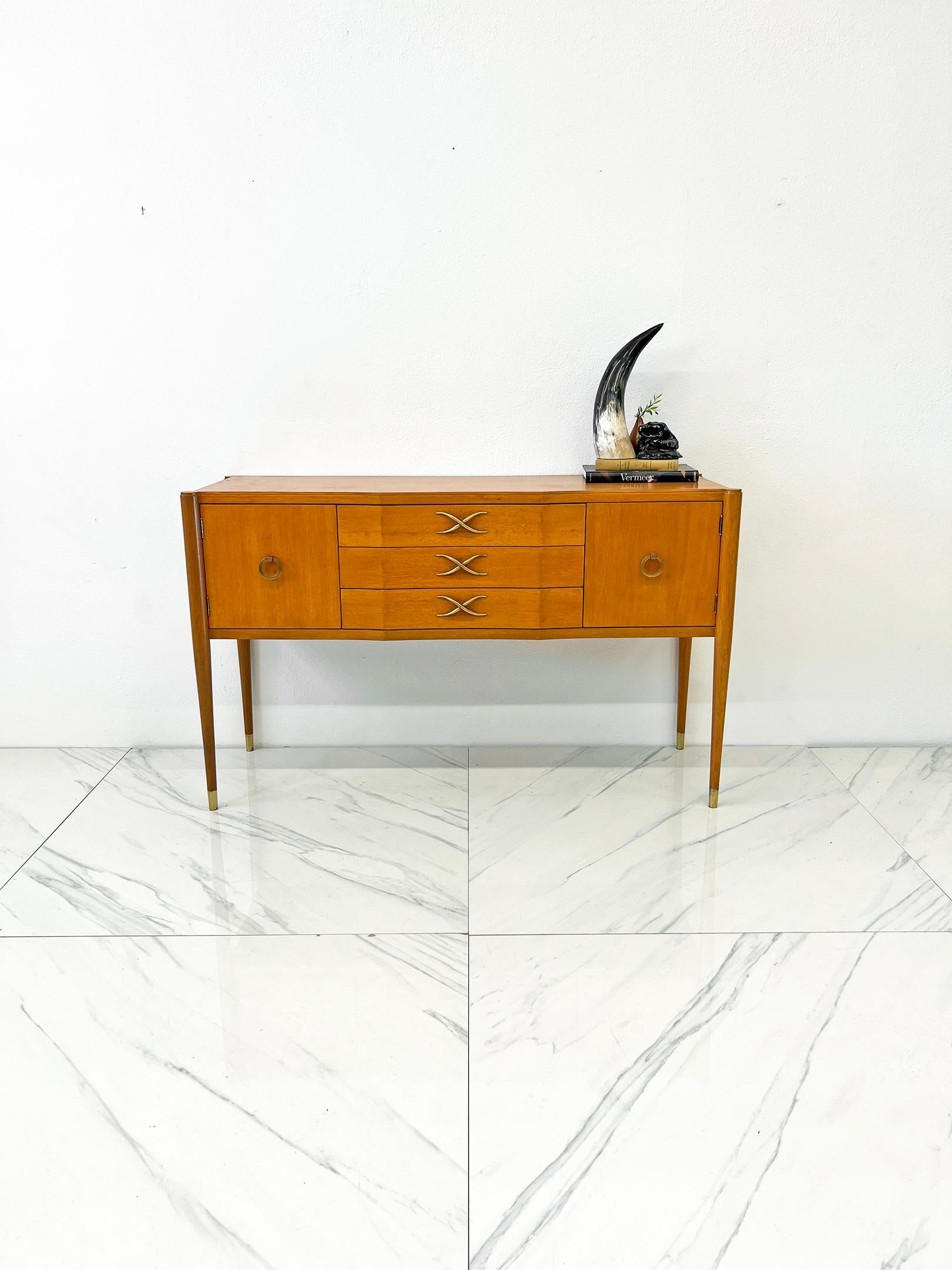 This credenza epitomizes Paul Frankl's California cool. Frankl, who's know for his enormously collectable design worked with Richard Neutra, R.M. Schindler, Gregory Ain, J.R. Davidson in their heydays. This piece was designed by Frankl during his
