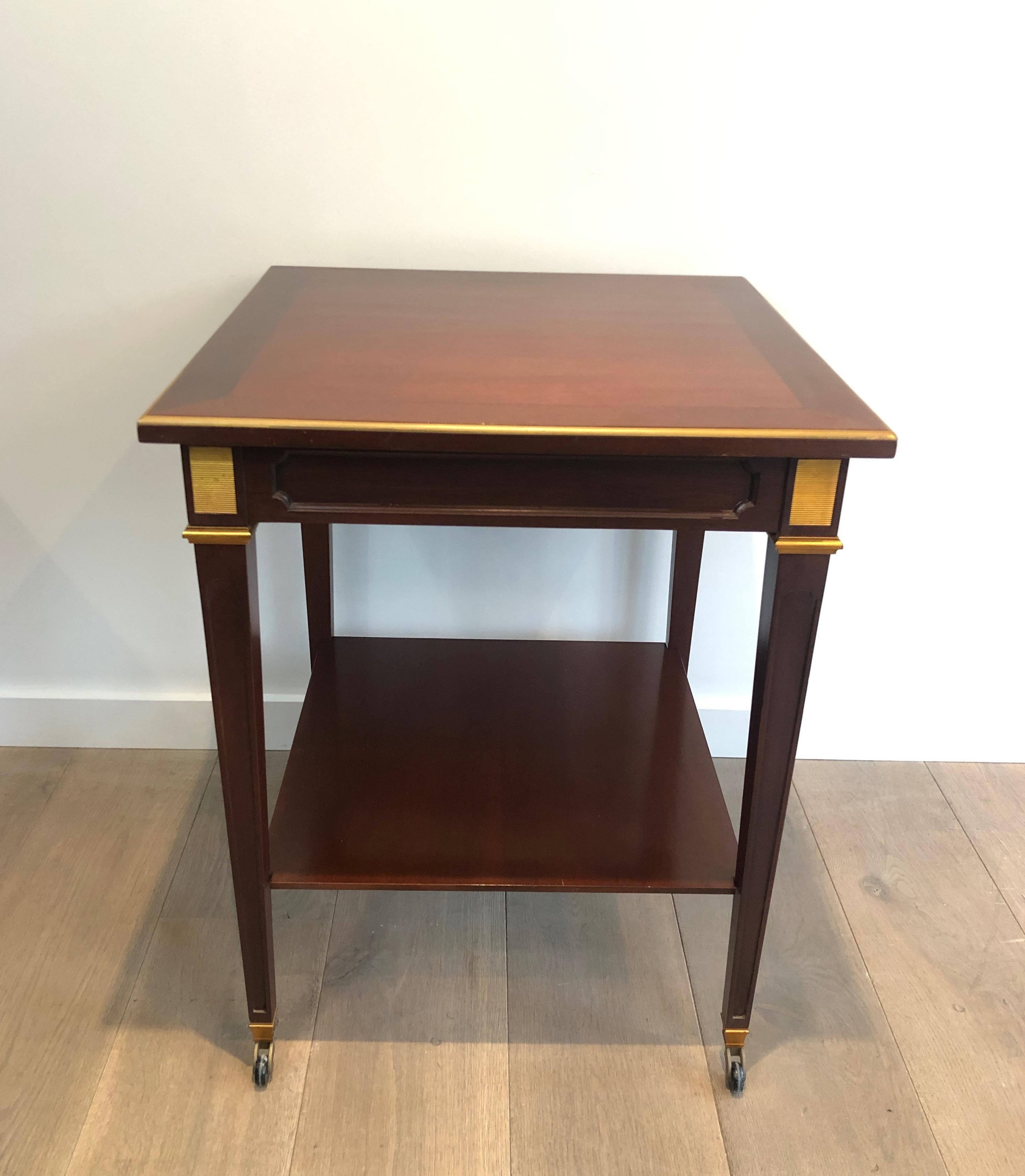 Neoclassical Mahogany and Brass Two Tiers Center Table, This is a French Work by Hugnet Sign For Sale