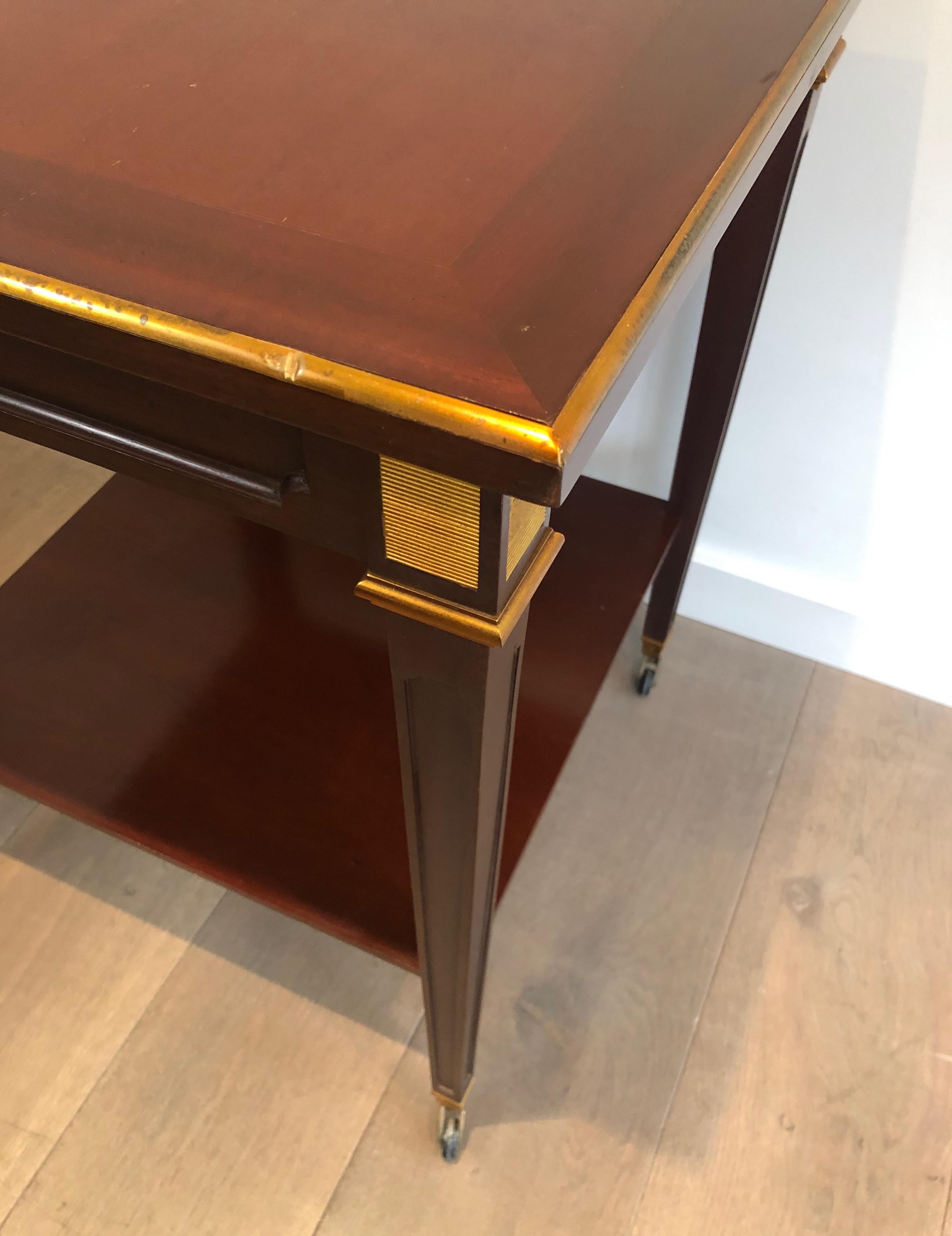 Mid-20th Century Mahogany and Brass Two Tiers Center Table, This is a French Work by Hugnet Sign For Sale