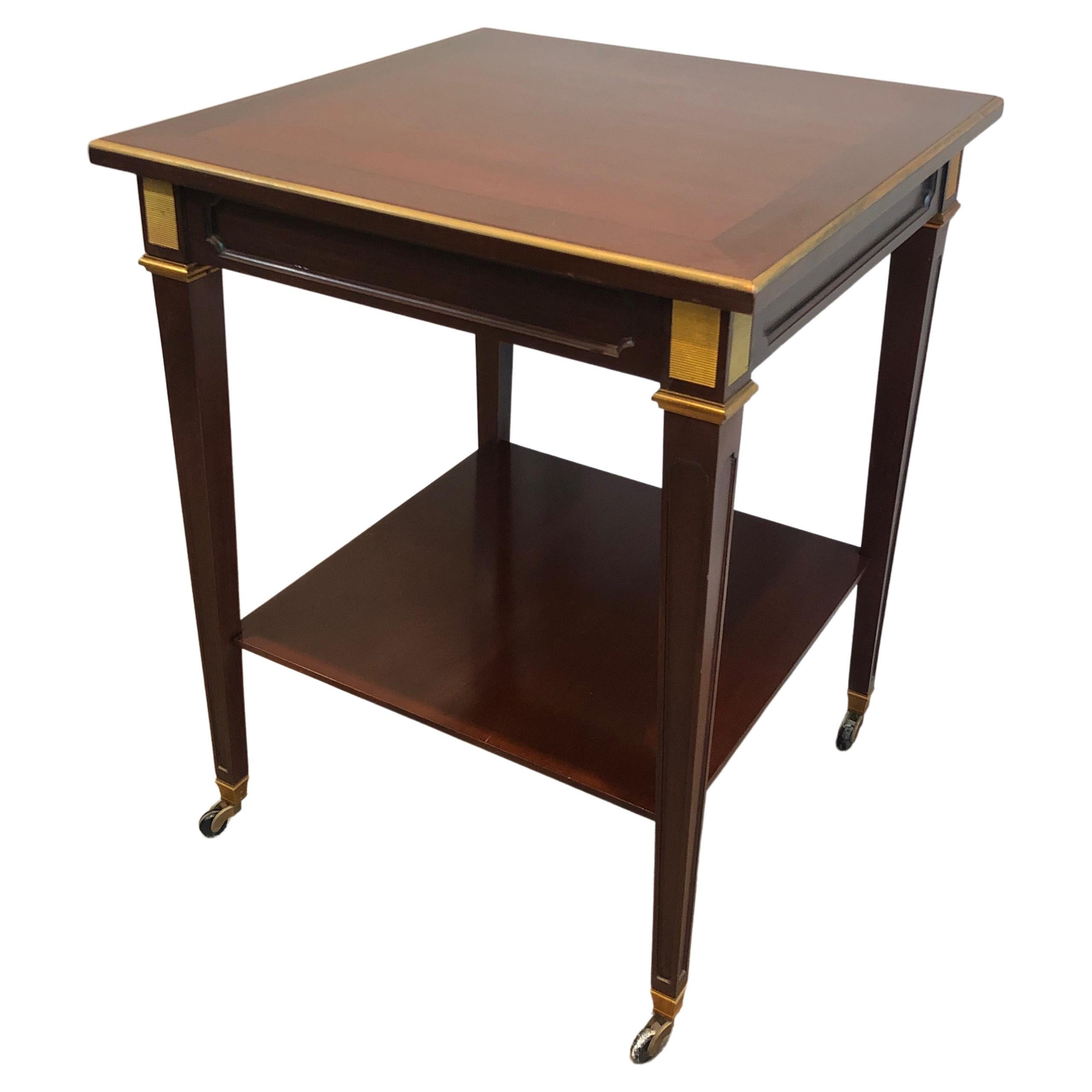 Mahogany and Brass Two Tiers Center Table, This is a French Work by Hugnet Sign For Sale