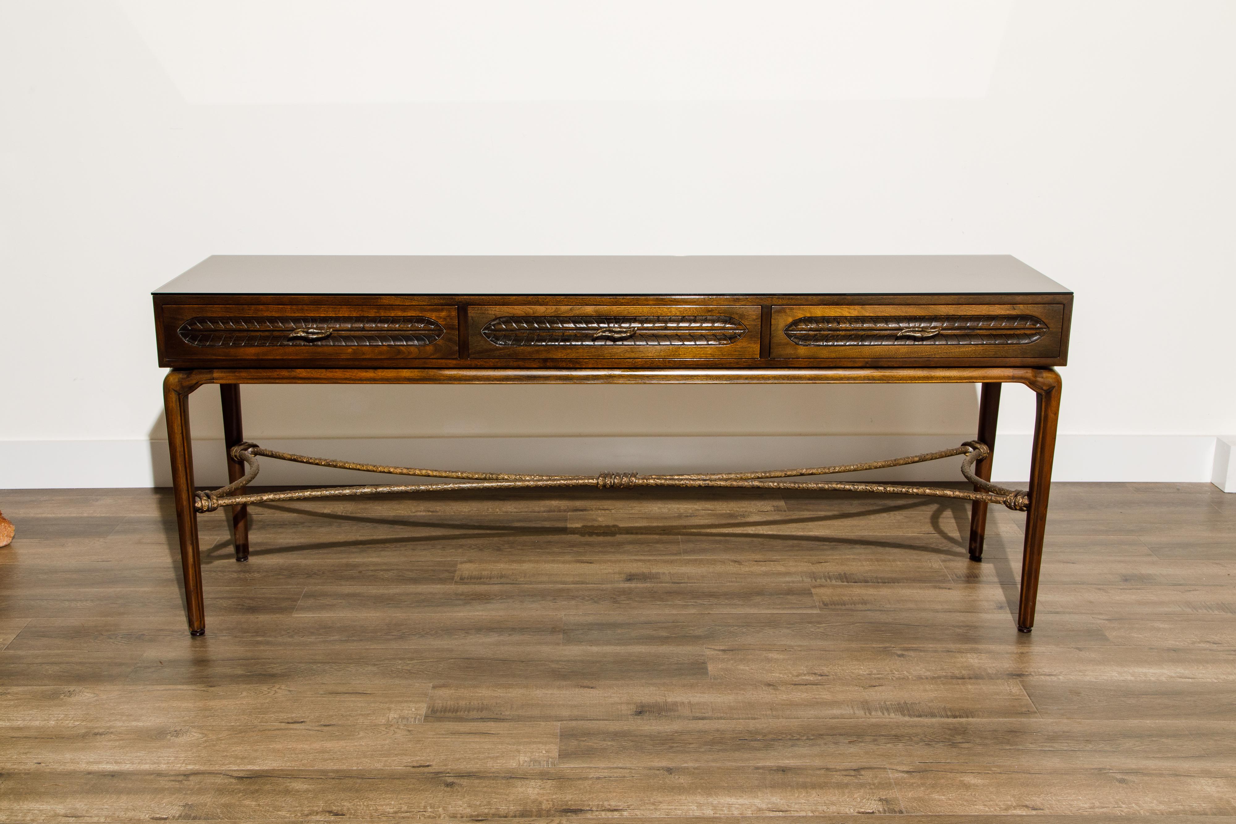 This classy Mahogany and Bronze console table by Maurice Bailey for Monteverdi-Young is the perfect solution for the interior designer who needs a gorgeous looking console table that can also function as a sideboard. Inside two of the drawers which