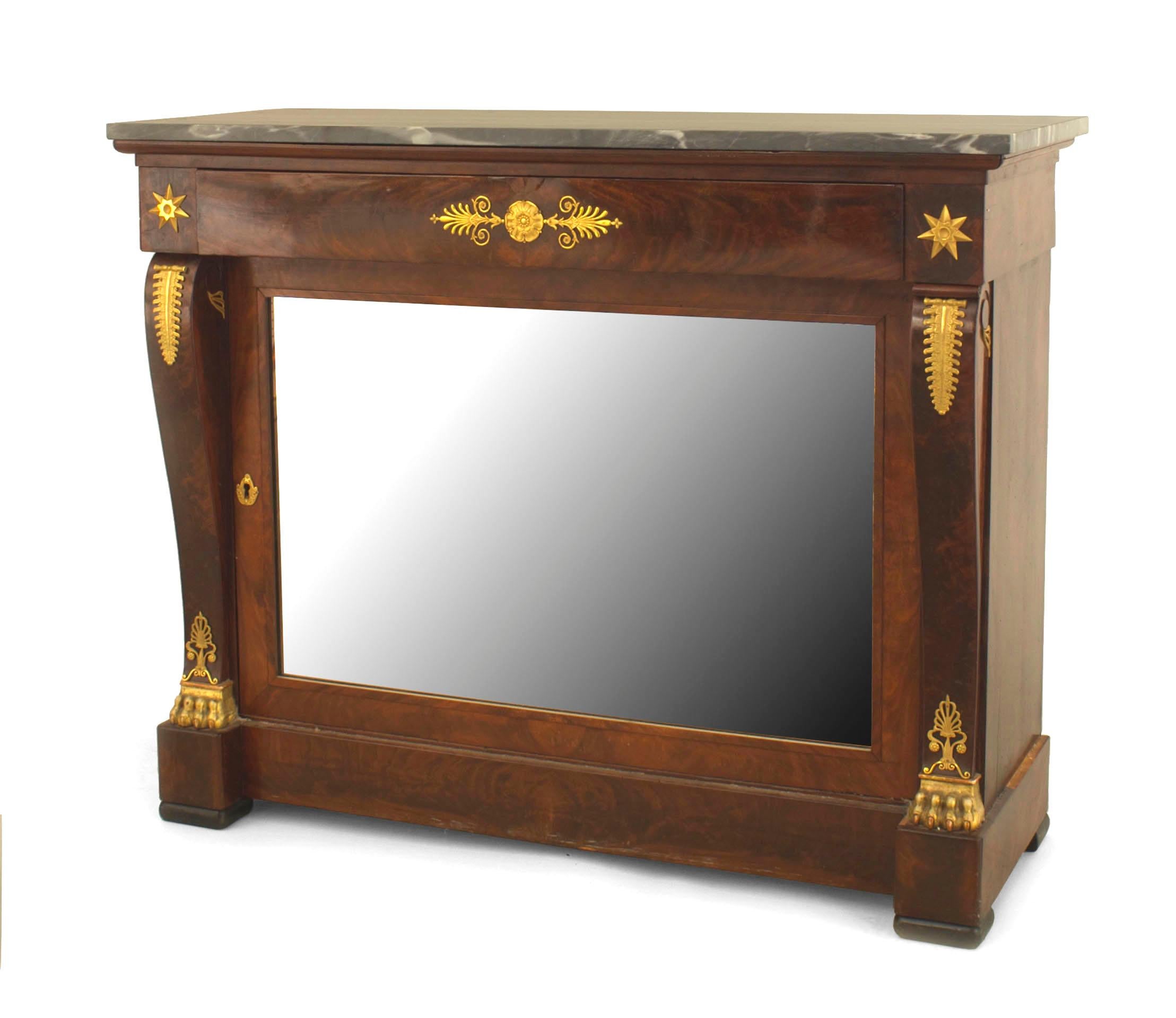 French Empire-style (19th Century) mahogany & bronze trimmed console table with scroll form sides and a drawer over a mirrored door with a grey marble top.
