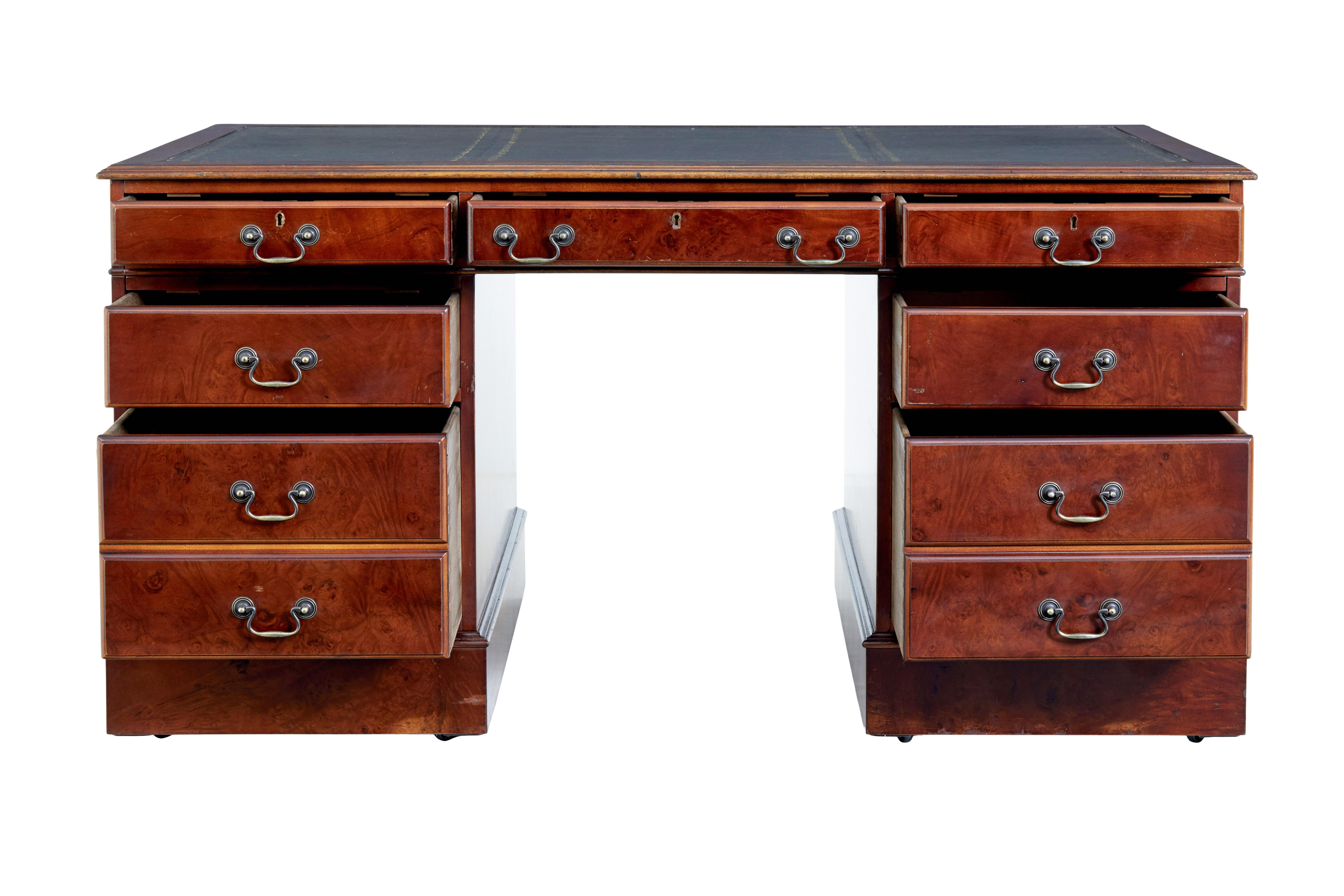 Mahogany and burr leather top pedestal desk circa 1990.

Good example of a 19th century designed desk. Which is in 3 sections, being the top and 2 pedestals.

Top surface with green leather writing surface decorated with gold tooling.  1 drawer