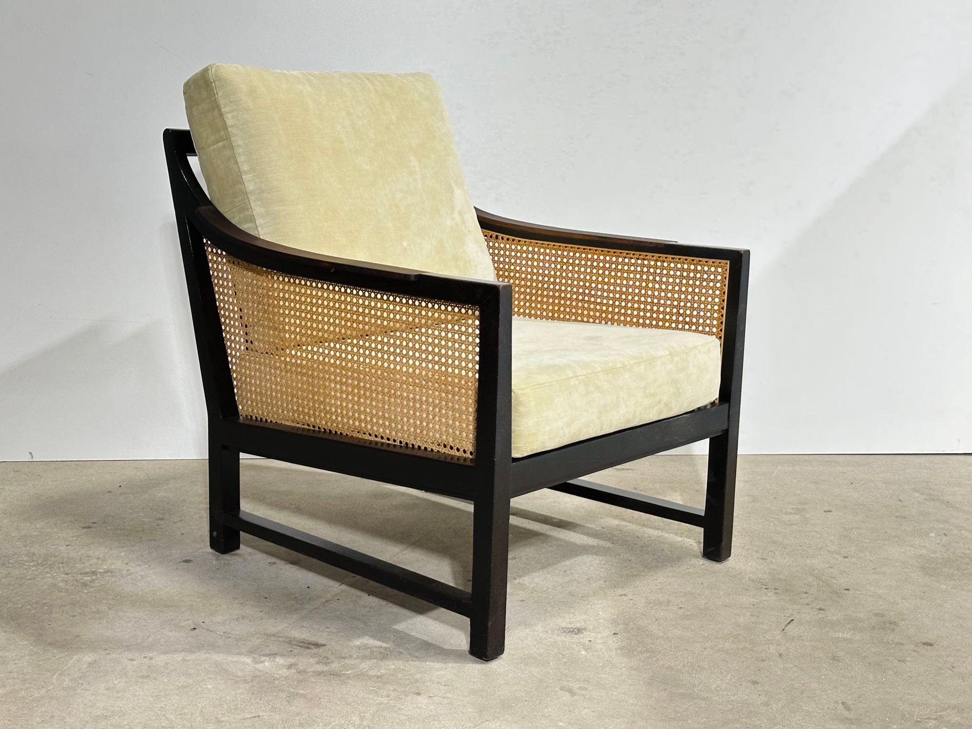 Mahogany and Cane Lounge Chair by Edward Wormley for Dunbar, 1950’s. The armrests are rosewood.
Measures 26” wide 30.5” deep 31.5” tall to top back pillow, seat height 16” seat depth 19”