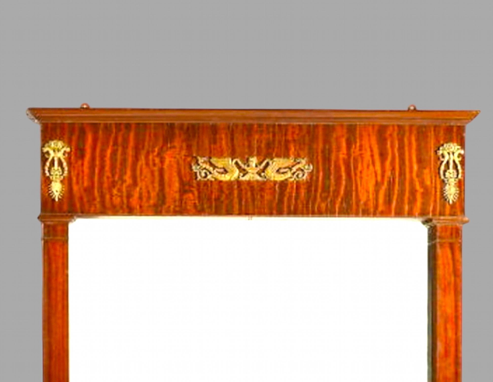 This is a large and imposing mahogany and gilt metal mounted wall mirror in the Empire taste, some aging to silvering of mirror plate as seen. Very heavy.

Length 167 cm and Width 123 cm with Depth 8 cm Total. Plate 134 cm x 100 cm