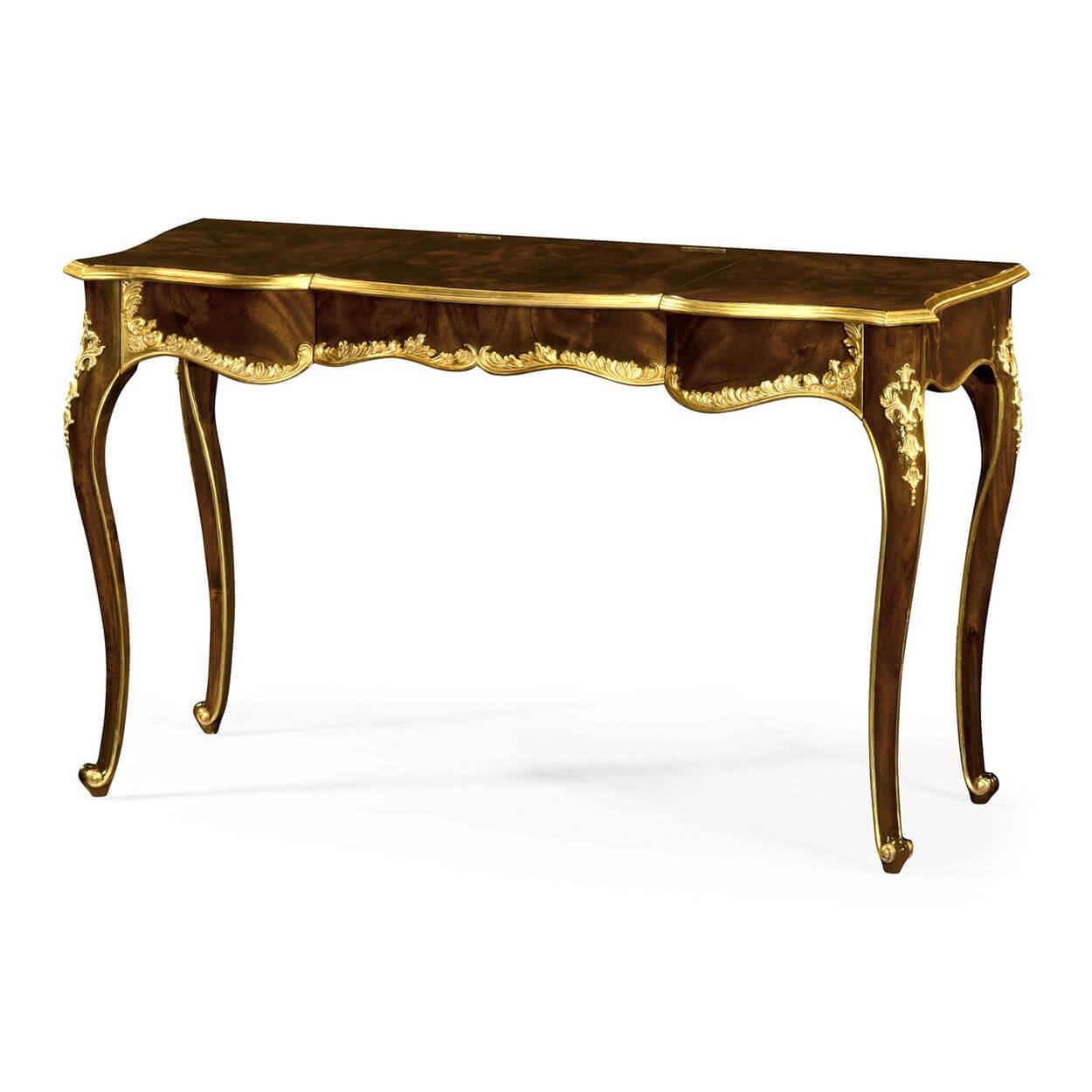 A fine English Chippendale style Rococo mahogany dressing table with a serpentine front, carved and gilded leaf edge, fitted with a dressing mirror, jewelry boxes, and internal drawers, raised and cabriole legs and scroll feet.

Dimensions: 50