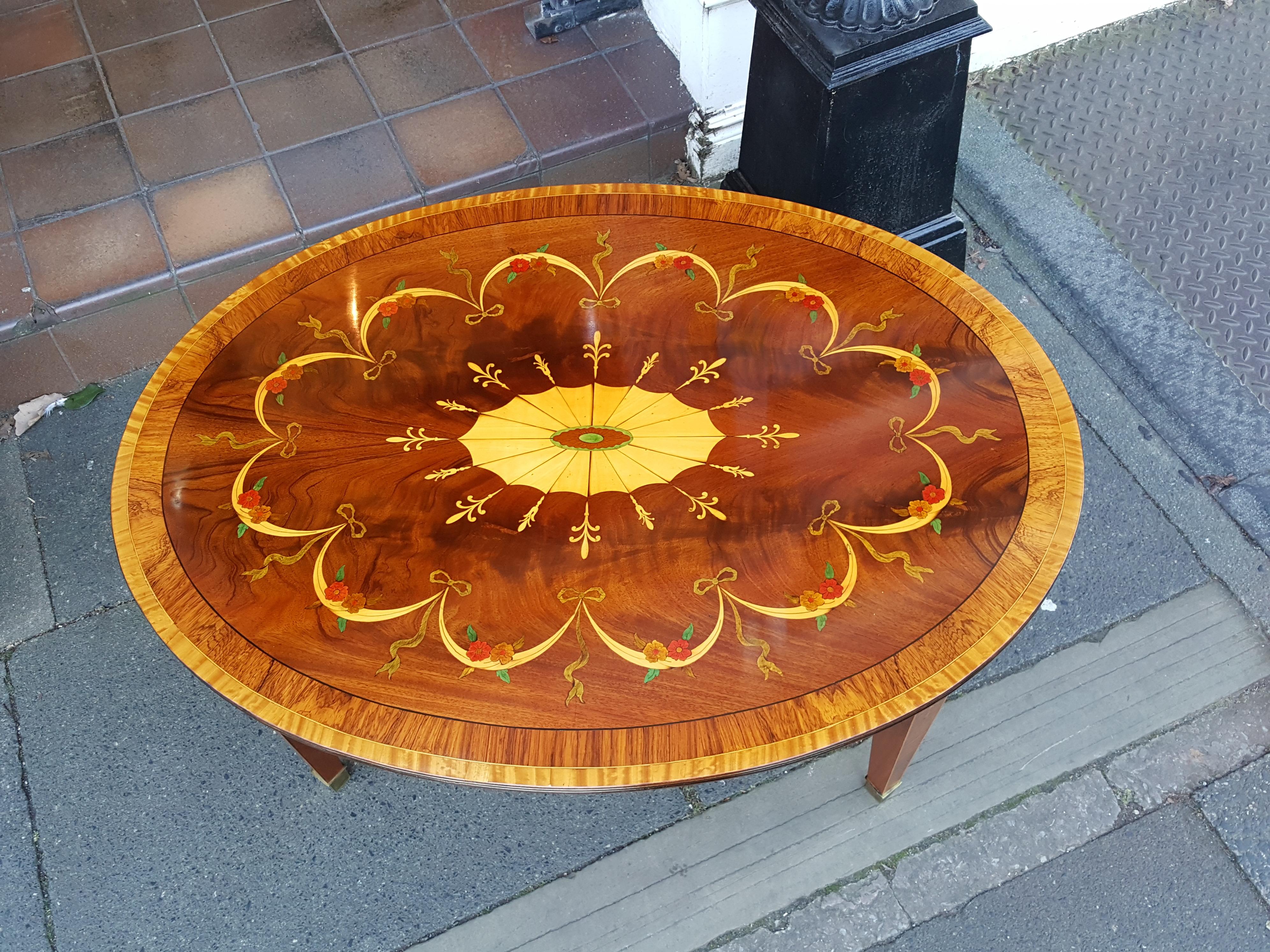 Mahogany and inlaid coffee table, late 19th century top with associated base.