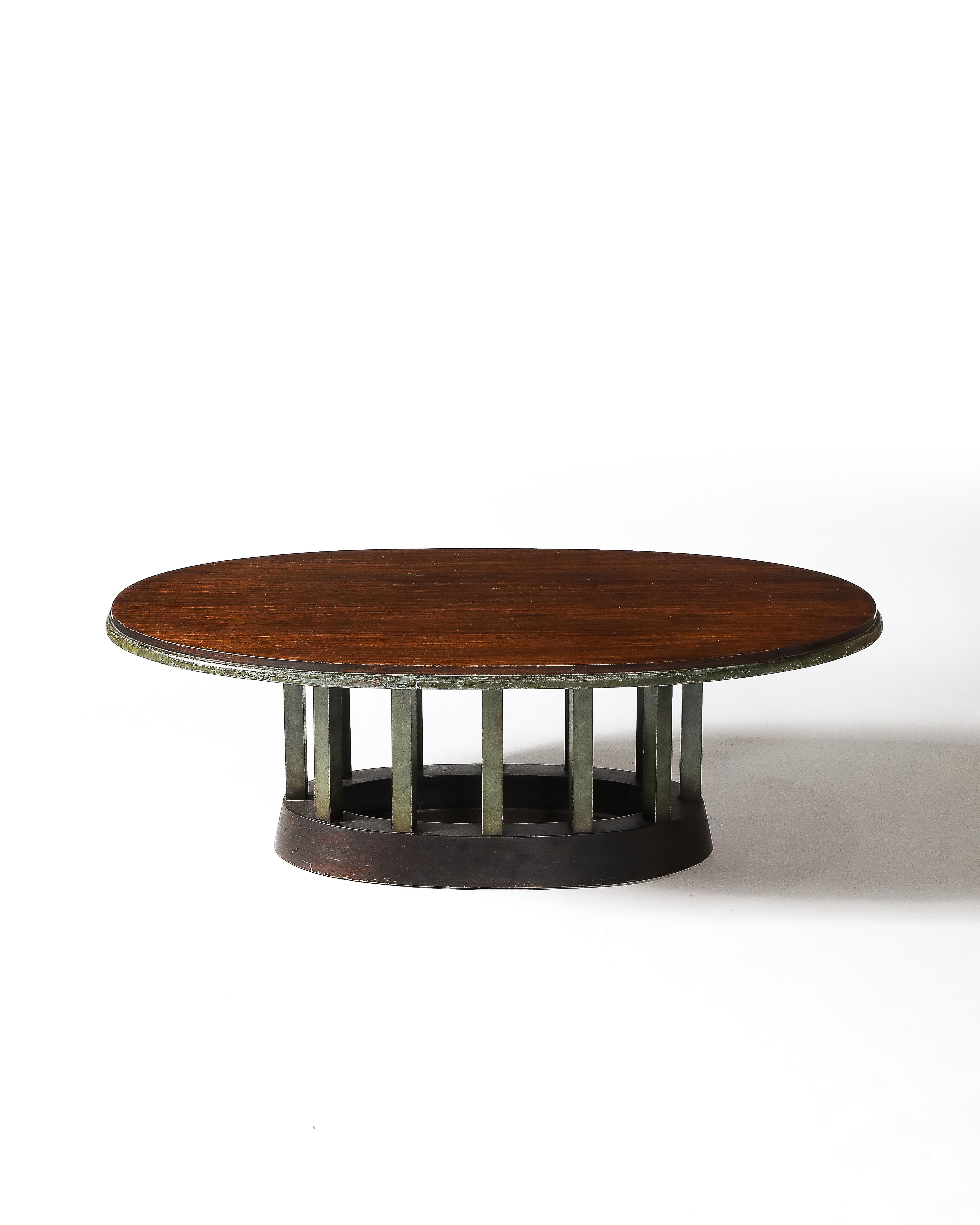 Ovular wood coffee table with a beautiful mahogany top. 