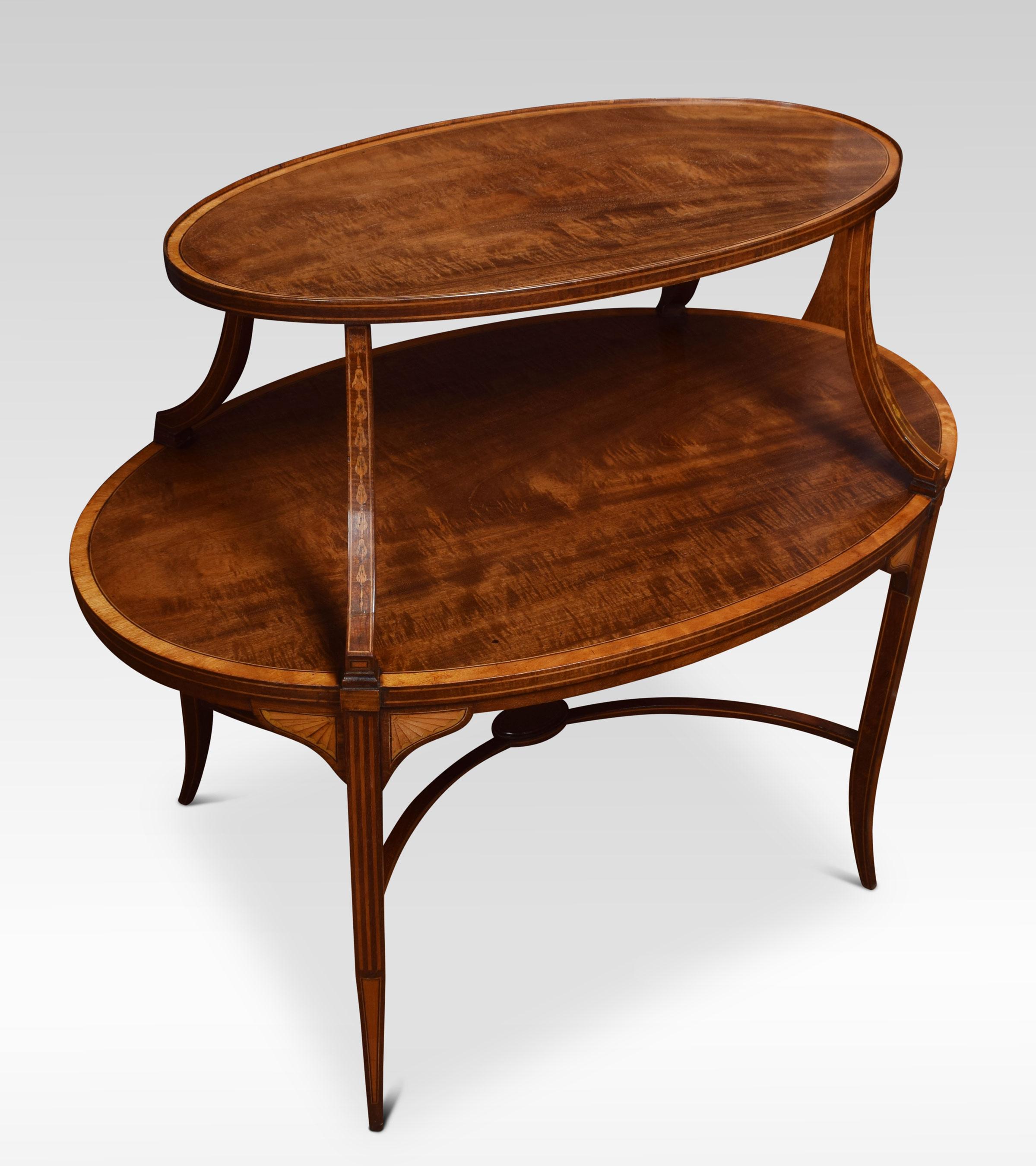 Mahogany and satinwood étagère, the top fitted with a removable oval glass-paneled tray, above under tier raised up on square block tapered and splayed legs, united by curved stretchers.
Dimensions:
Height 33 inches
Width 35 inches
Depth 22