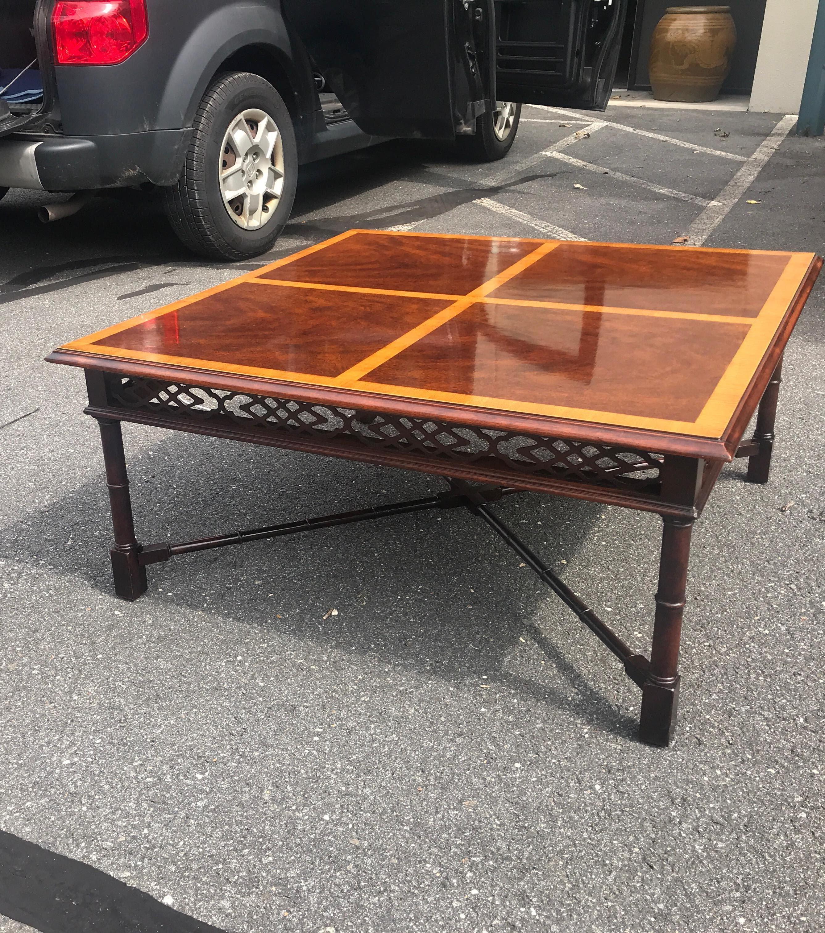 Large 38 inch square English Regency style mahogany cross banded coffee table. The square top with satinwood banding resting of four regency style legs with pierced apron all around. Recent French Polish in very good condition.