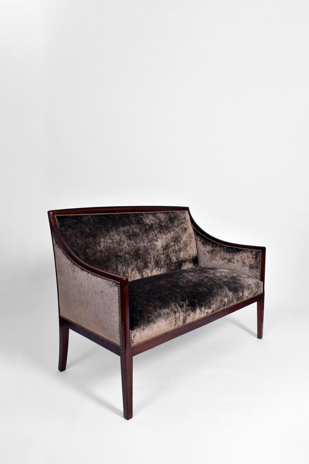 Two seats mahogany, cotton velvet covered sofa in the style of Jean-Michel Frank. France, 1940s.