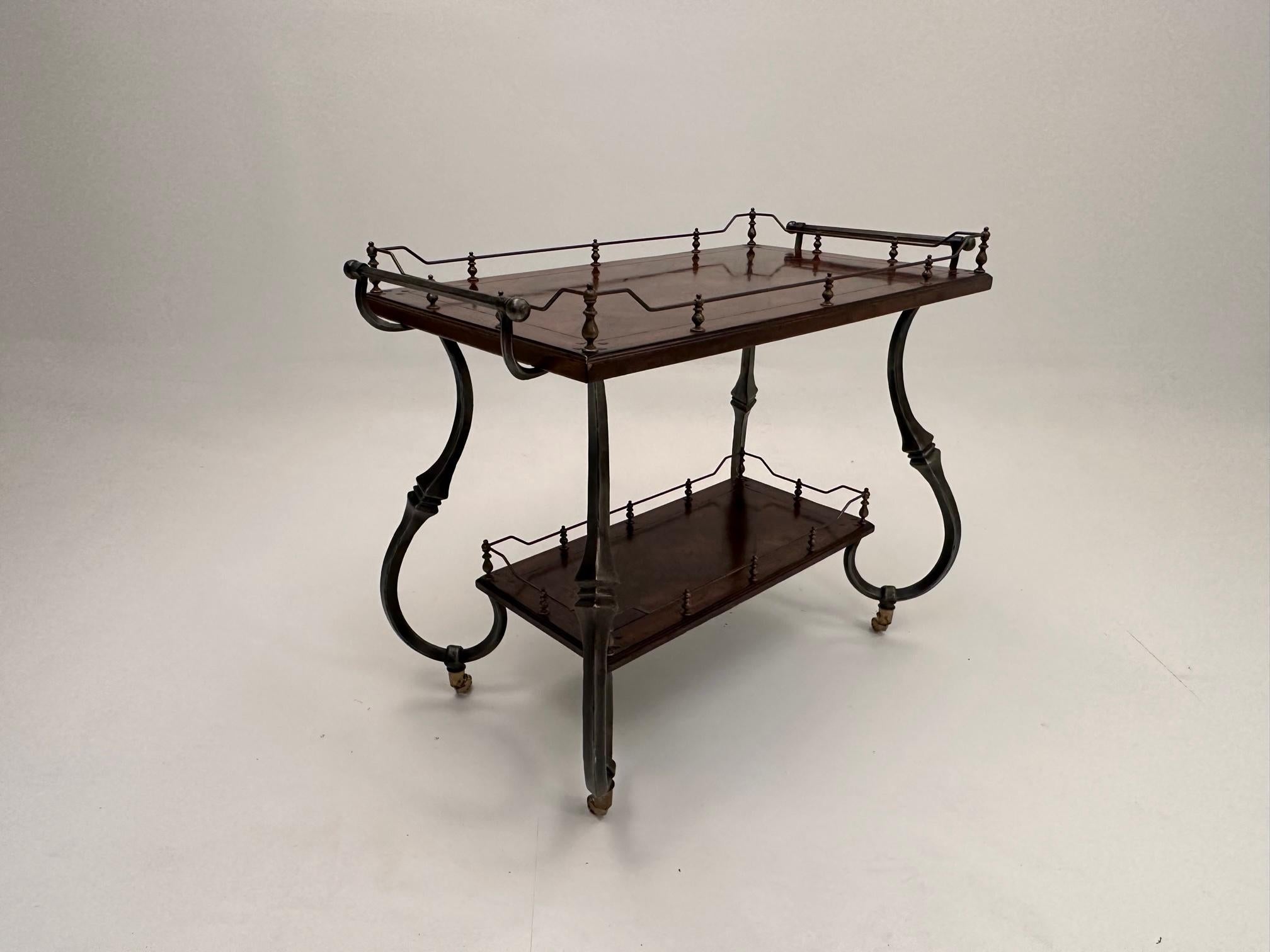 Gorgeous and elegant mahogany server or cart with inlaid parquetry top, pegged corners and lovely wrought iron frame.  There's a brass and steel gallery around the top surface (33