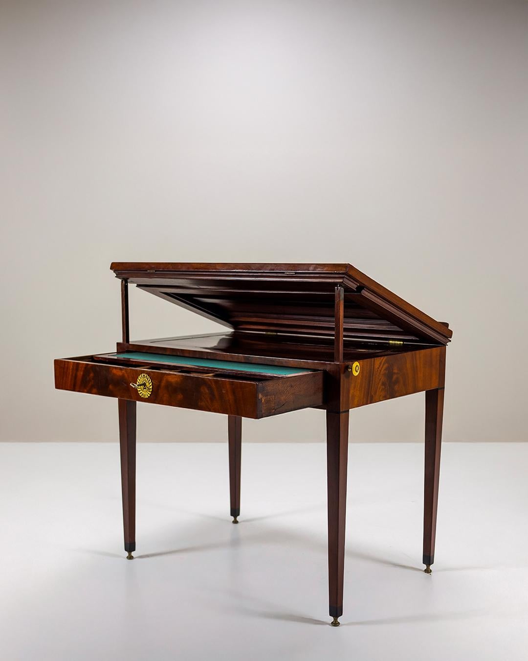 Beautiful Empire mahogany architects table by Jean-Joseph Chapuis (1765-1864).
Jean-Joseph Chapuis (born in Brussels) was a famous furniture maker. He obtained a master craftsman title in Paris allowing him to personally mark his work.

This