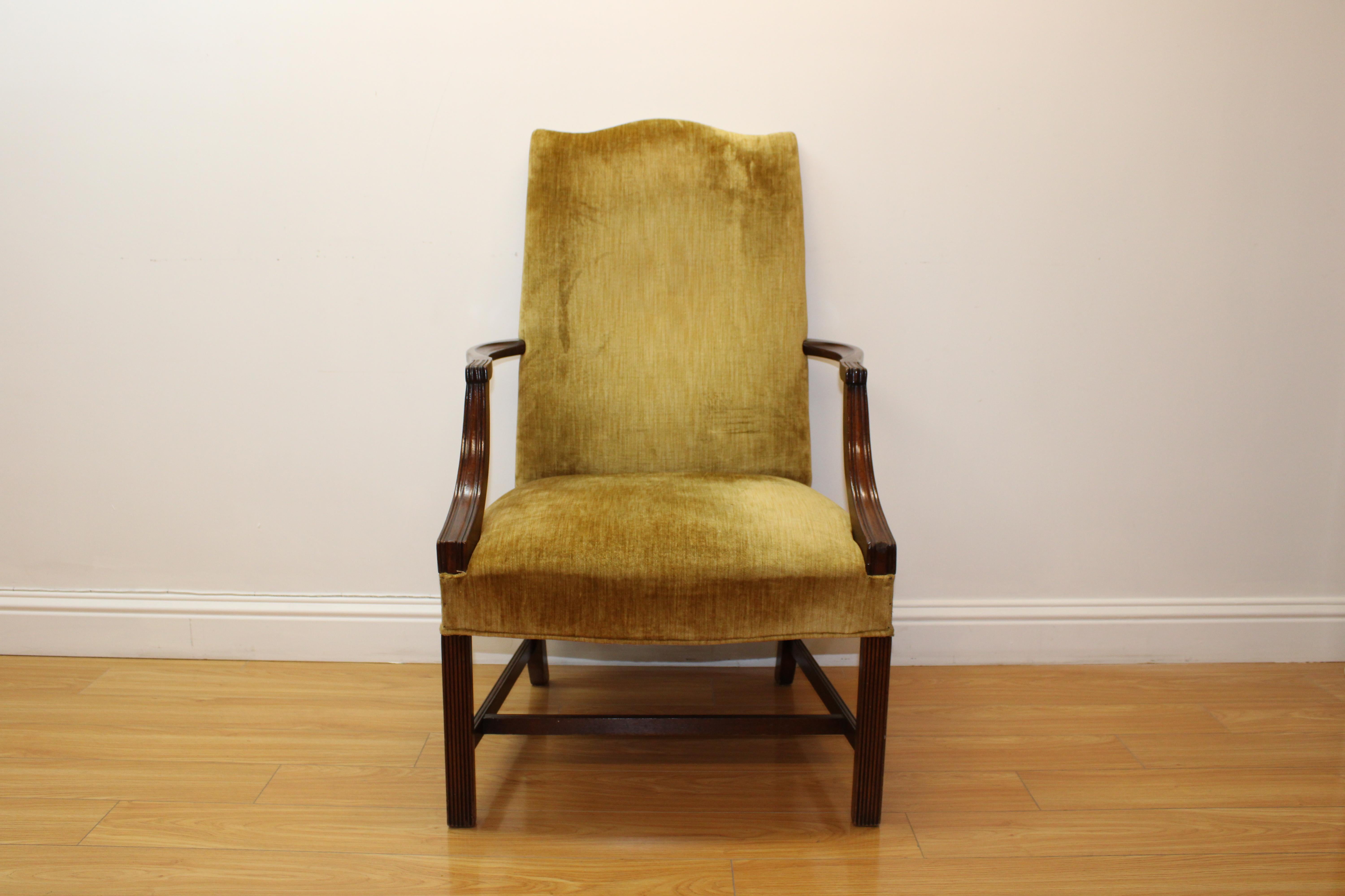 C. 20th century.

High back mahogany arm chair w/ velvet upholstery.