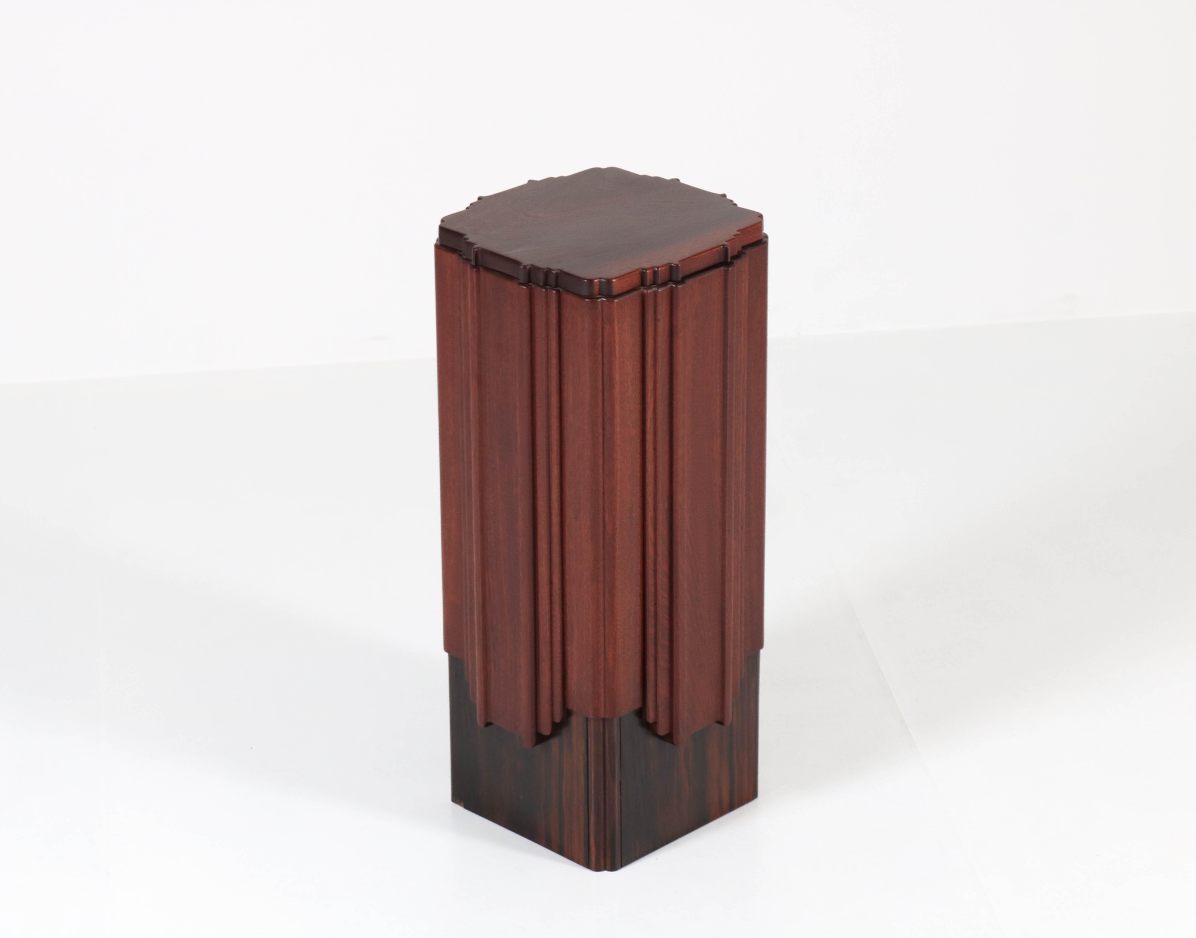 Offered by Amsterdam Modernism:
Stunning and rare Art Deco Amsterdam School pedestal.
Attributed to Hildo Krop.
Striking Dutch design from the twenties.
Solid mahogany with Macassar ebony veneer.
In very good condition with minor wear consistent
