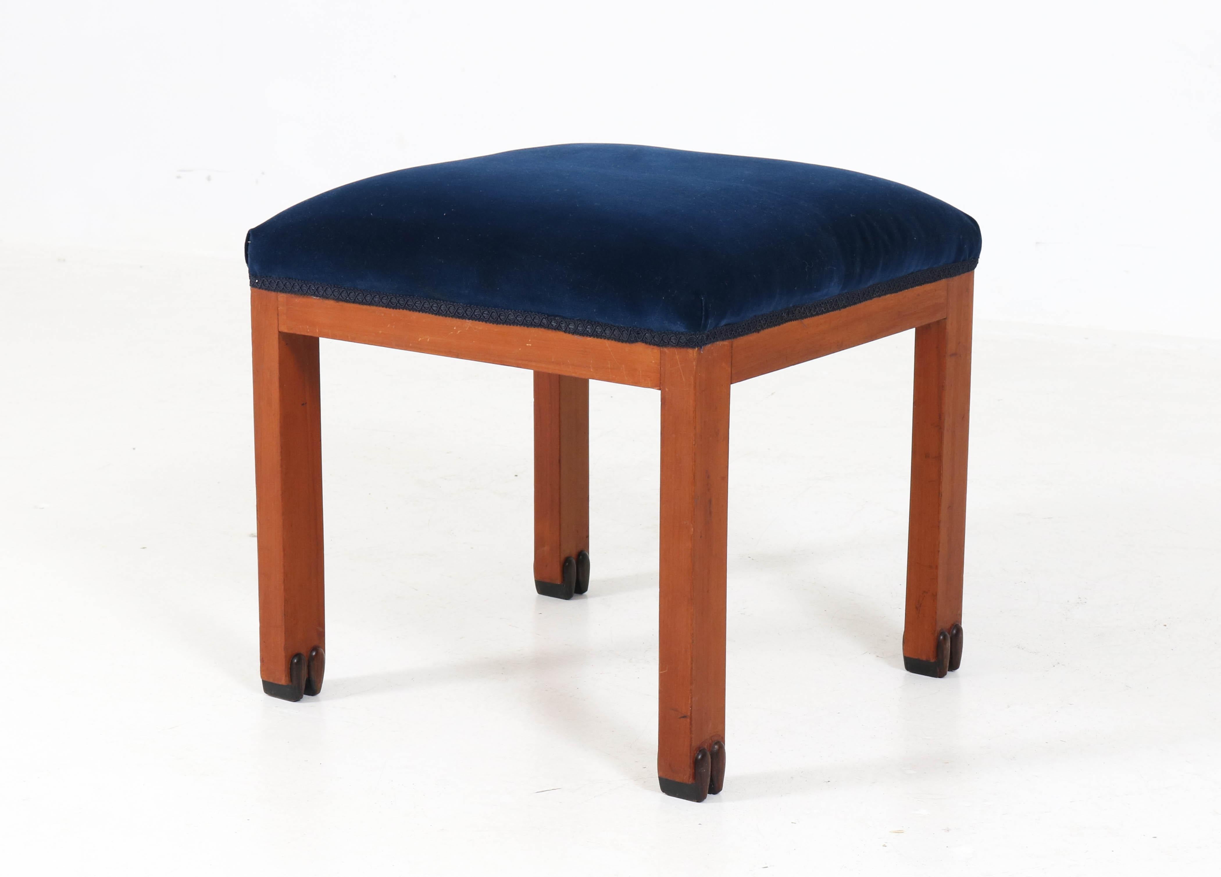 Offered by Amsterdam Modernism:
Wonderful Art Deco Amsterdam School stool.
Striking Dutch design from the 1920s.
Mahogany with new blue upholstery.
Solid ebony Macassar details at the legs.
In good original condition with minor wear consistent with