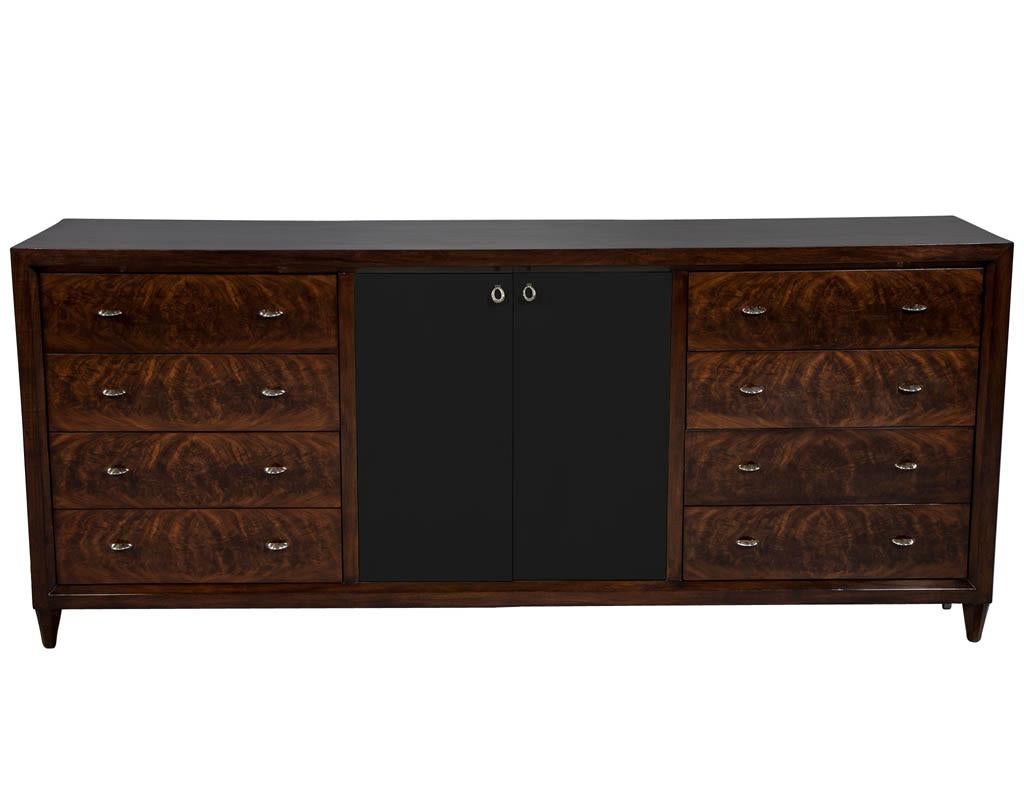 Mahogany Art Deco inspired cabinet buffet. This luxurious Art Deco mahogany cabinet features drawer faces with custom stainless steel ring hardware, accentuated with black goatskin finished parchment doors for a luxe, sleek and refined look.