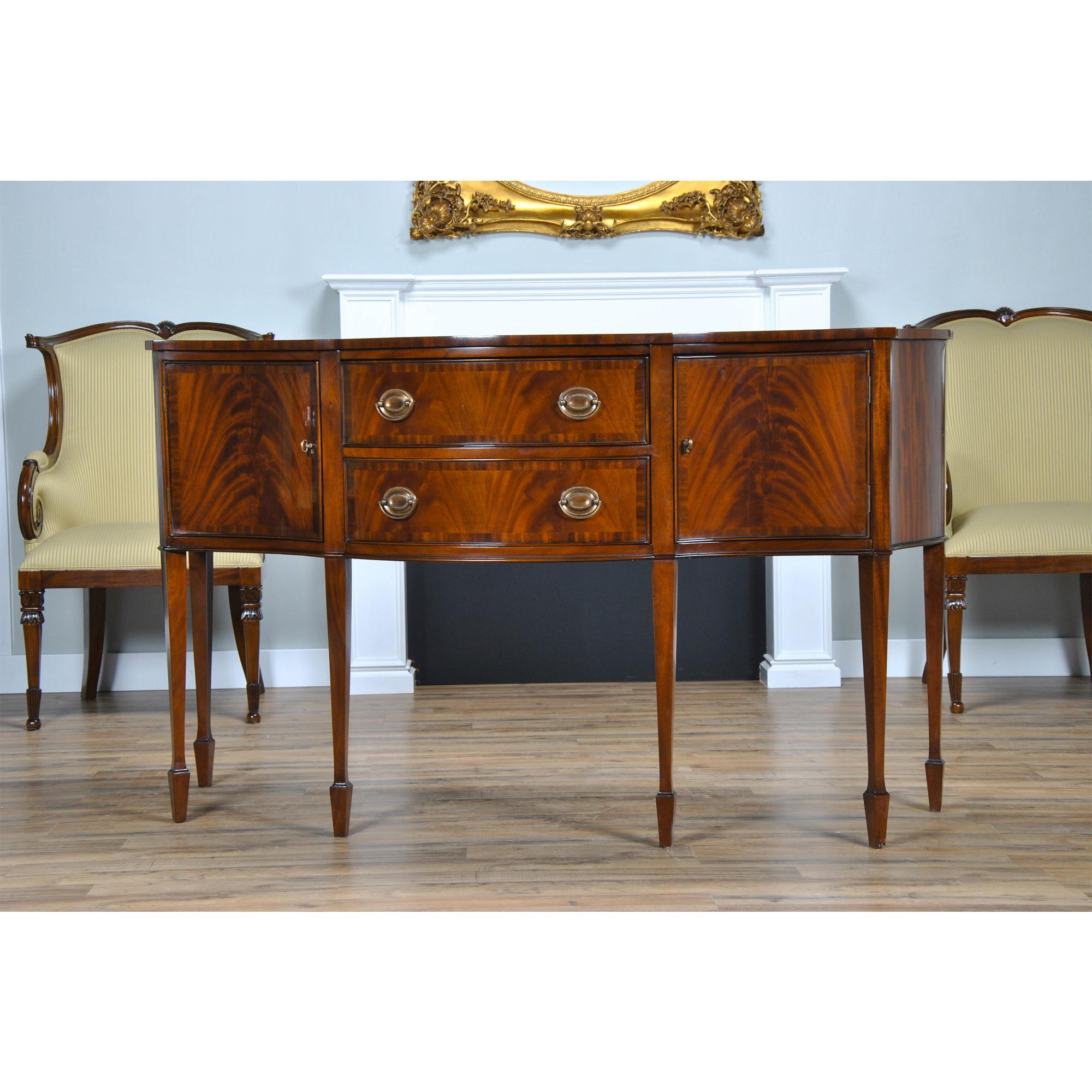 The Mahogany Banded Sideboard or buffet is subtle and understated in appearance. The banding across the top of this item and the banding around the outside of the drawer and door fronts of this piece offer a subtle contrast to the fine quality