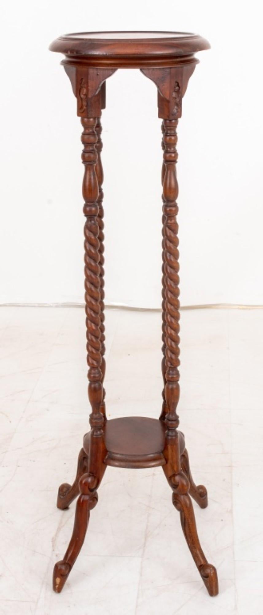 Mahogany Barley-Twist Pedestal

Design: Circular top supported by four turned and twisted columns.
Construction: Joined by an entretoise above splay feet.

Dimensions: 42
