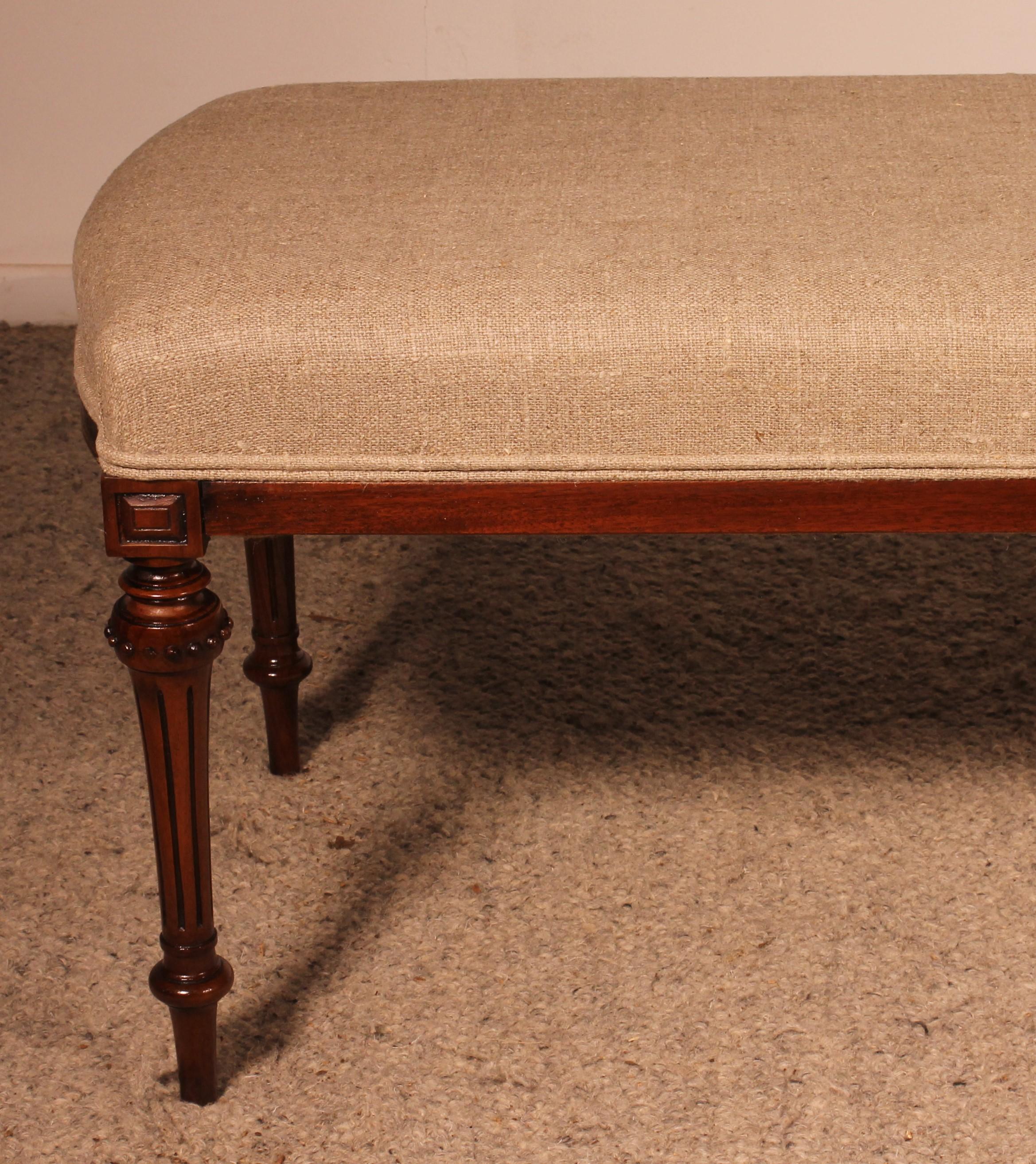 Victorian Mahogany Bench From The 19th Century Covered With A Linen Fabric For Sale