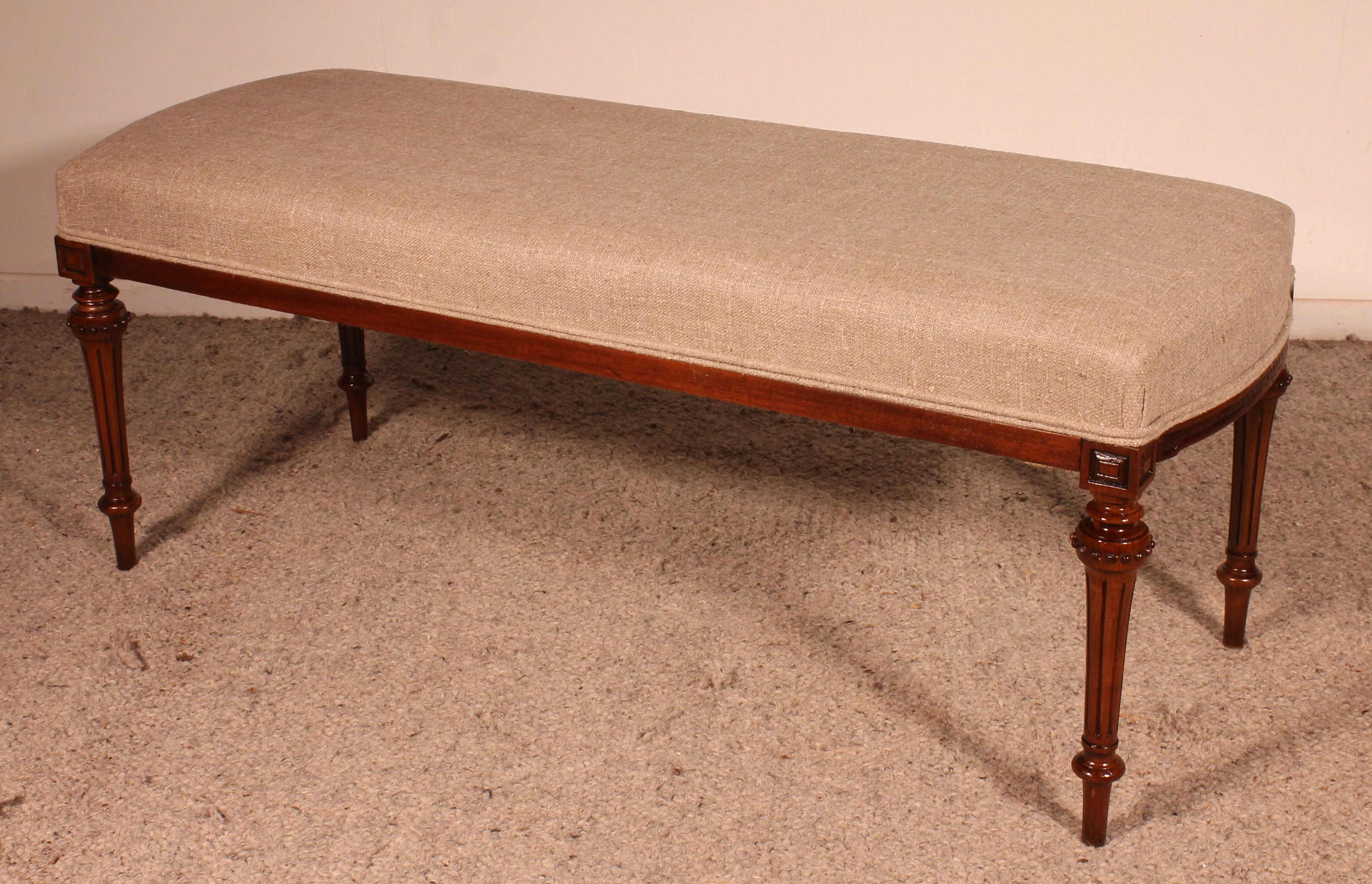 Mahogany Bench From The 19th Century Covered With A Linen Fabric For Sale 1