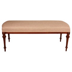 Antique Mahogany Bench From The 19th Century Covered With A Linen Fabric