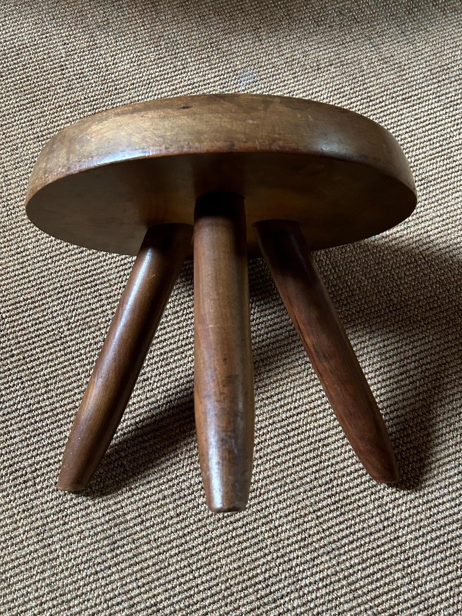 Berger mahogany stool by Charlotte Perriand, produced between 1950 and 1960