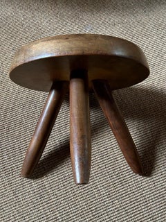 Mahogany Berger stool by Charlotte Perriand