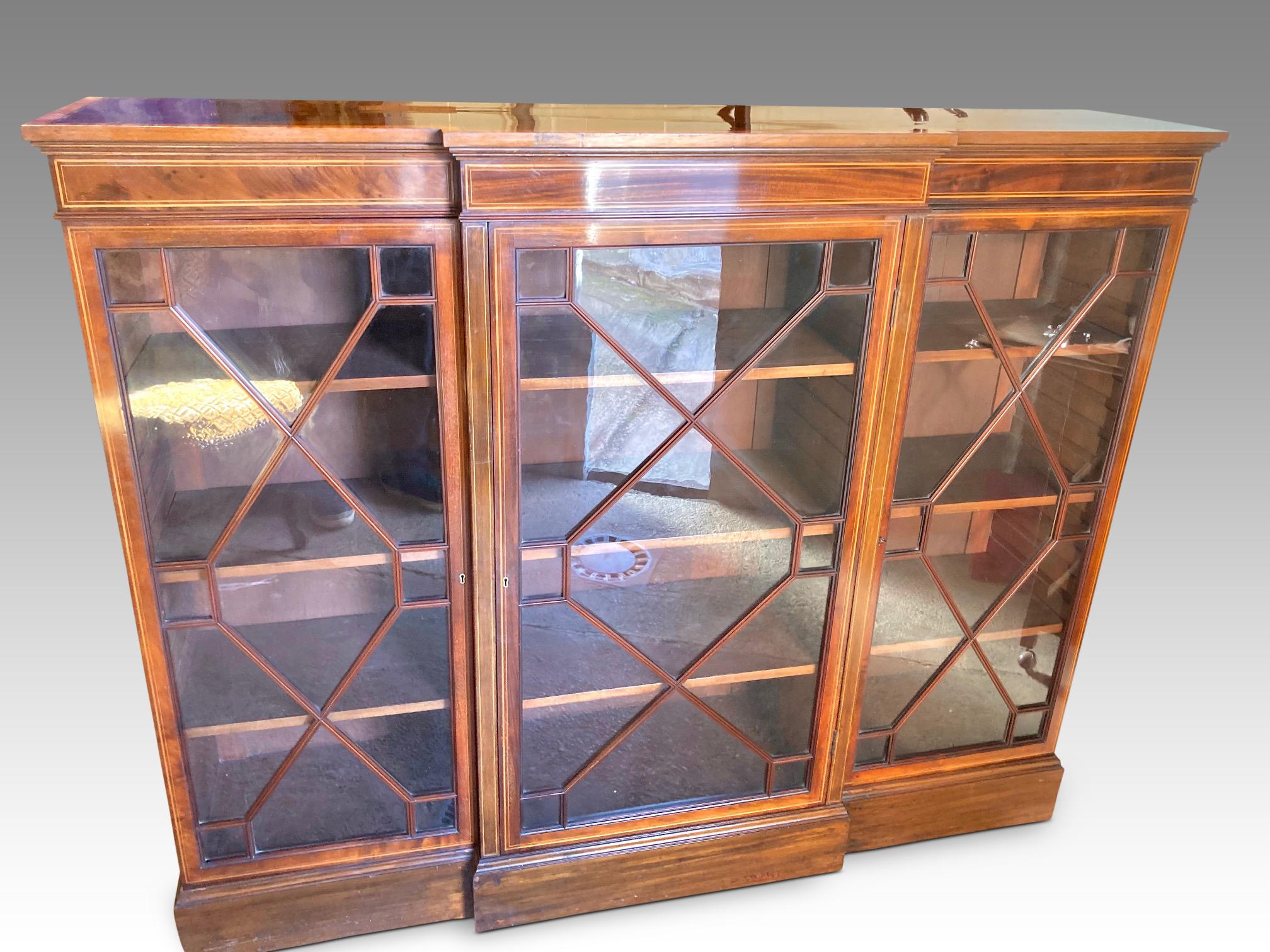 Fine quality English mahogany bookcase dating from the early 1900s. Edwardian period. This delightful bookcase has been well cared for by former owners. It is exceptionally attractive, clean, from a non smoking home and is in excellent condition.