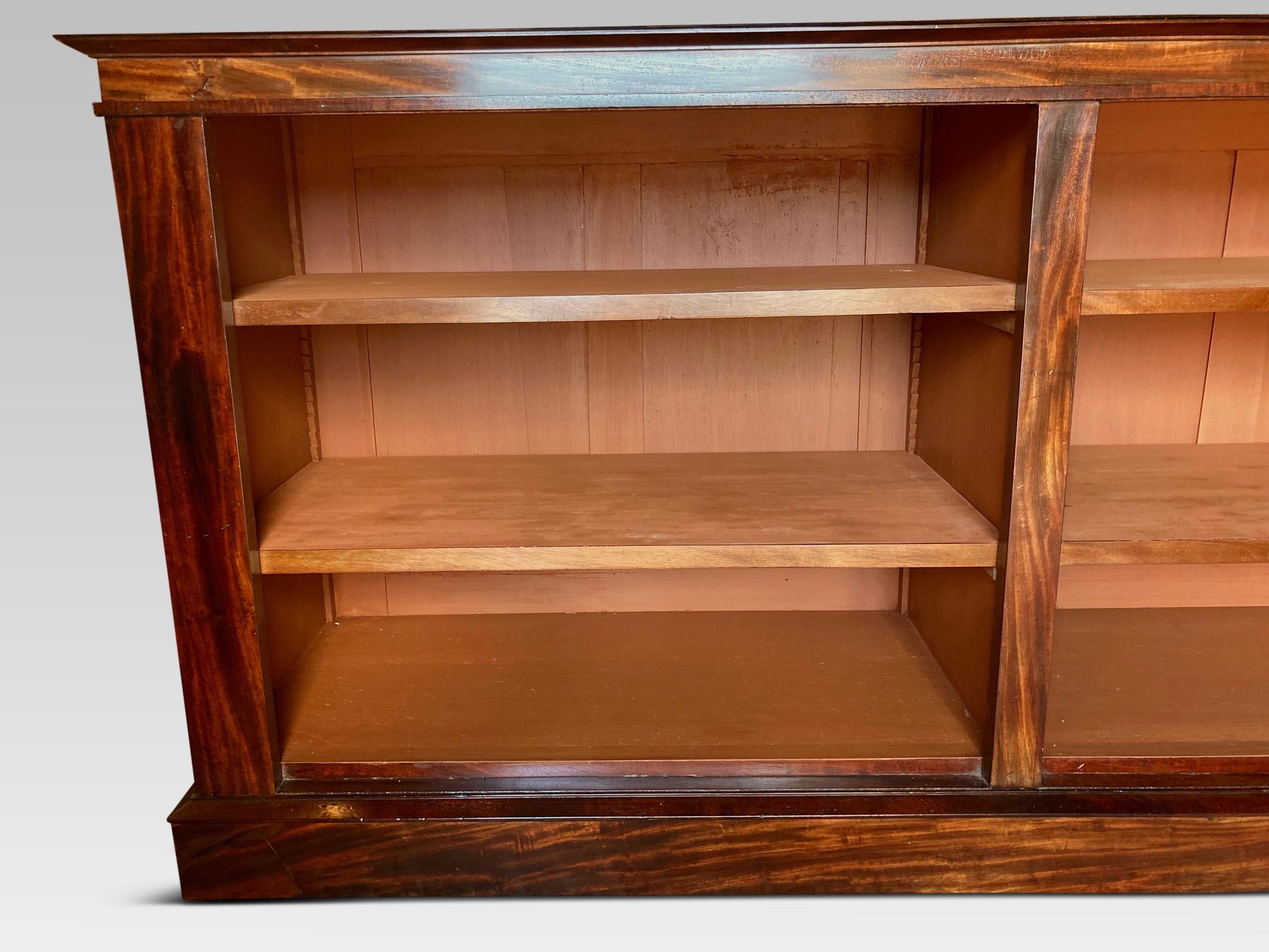 Attractive mid-19th century English library bookcase with 4 adjustable shelves.
This delightful antique bookcase stands on a plinth base. The bookcase is veneered
with well grained mahogany veneers and has a deep shelves. It
was most likely made